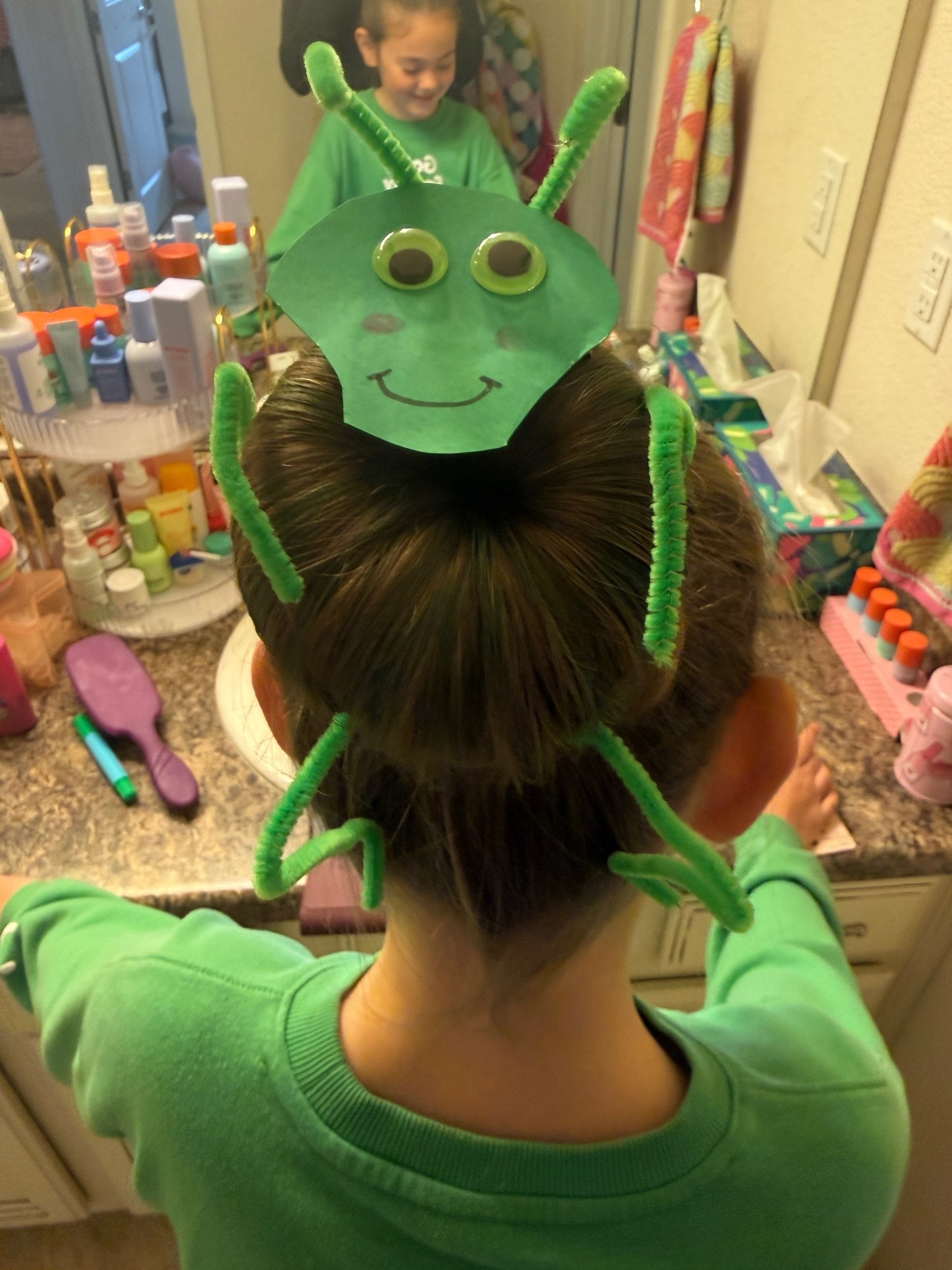 For crazy hair day at school, Winnie wanted a grasshopper. I am no Pinterest mom so I just hand drew a “derpy” (as she calls it) face, glued on googly eyes and glued his head to Bobby pins using hot glue. Then I glued pipe cleaner to Bobby pins for his legs. Lastly, I colored her bun with green hair chalk!

#LTKKids #LTKmomlife #LTKSeasonal