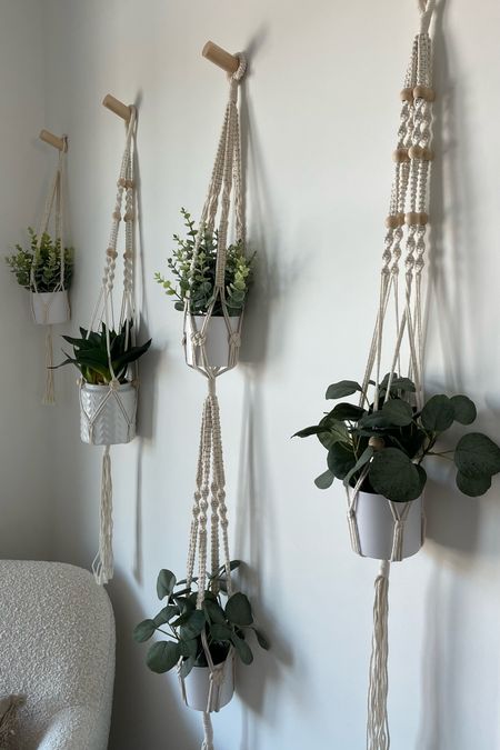 hanging plant wall with fake plants for the win! these $5 faux plants from target are a game changer if you lack a green thumb 😉 macrame planter | hanging plants | plant wall | fake plants | faux plants | home decor | neutral home decor

#LTKfamily #LTKhome #LTKunder50