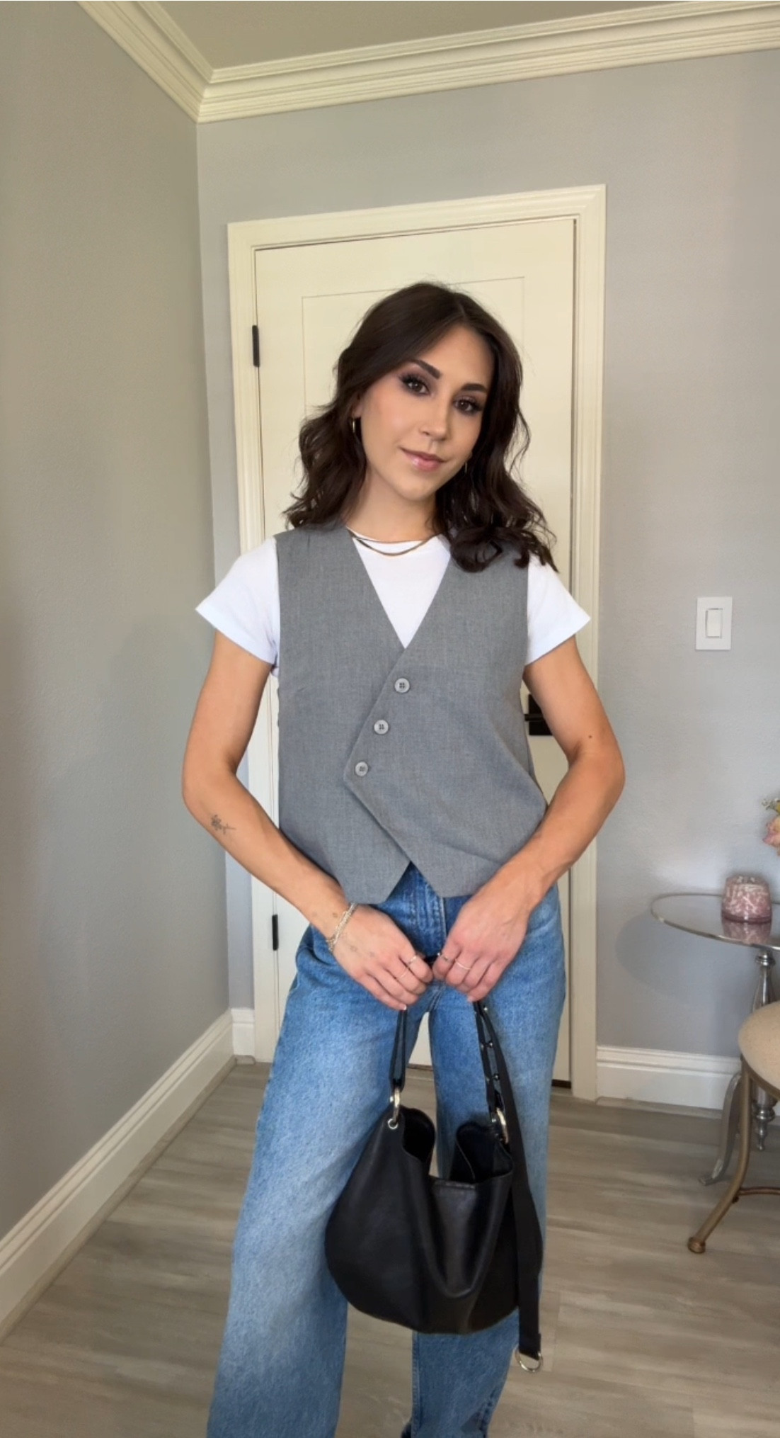 work ootd 🩶 loving this vest I picked up from H&M! Easy to dress up with a black skirt and slingbacks or down like I’ve done here with my softest Cary jeans from Reformation and some sambas

#LTKworkwear #LTKstyletip #LTKfindsunder50