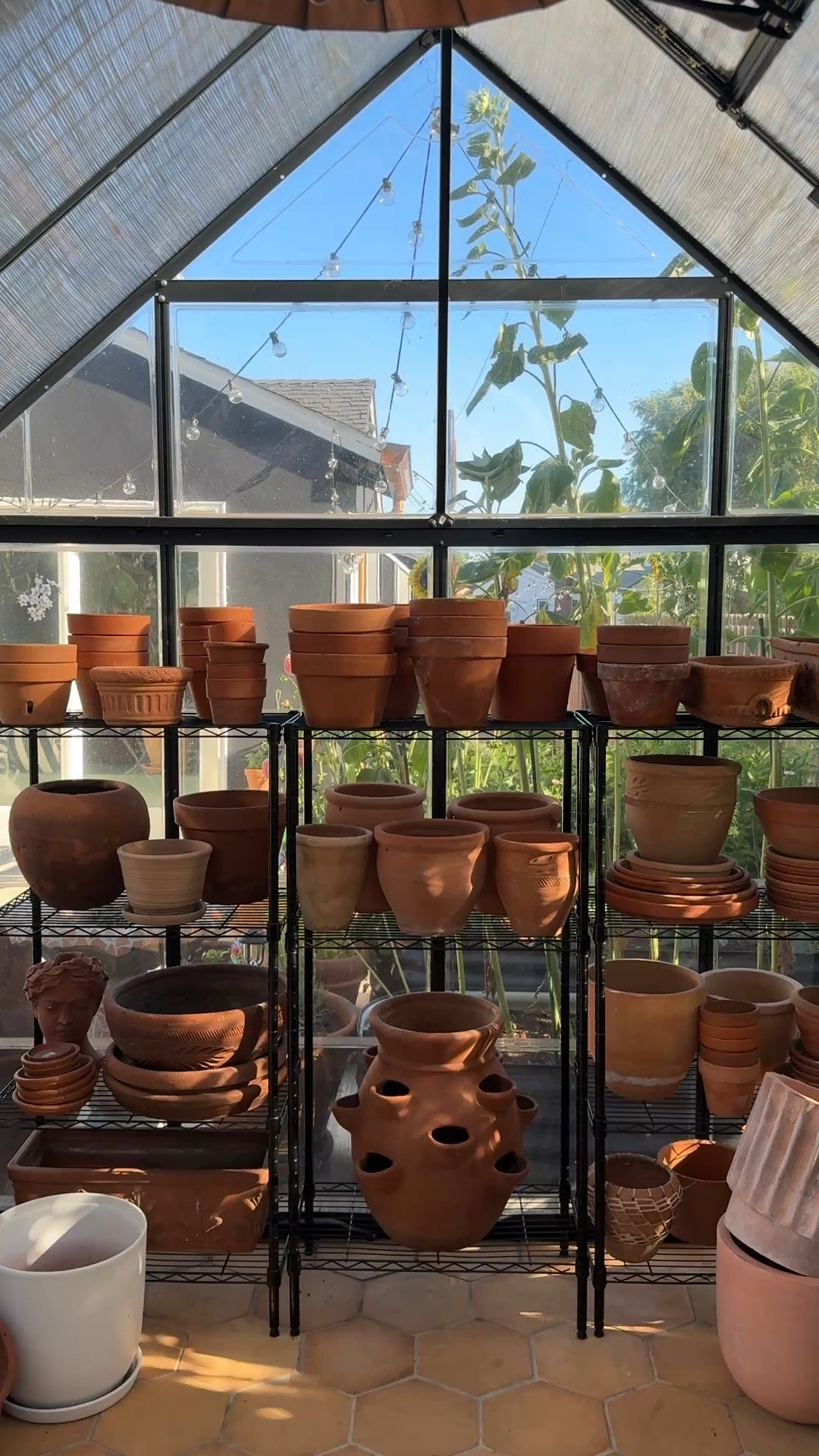 Metal adjustable shelves & terracotta pots

#LTKHome #LTKSeasonal