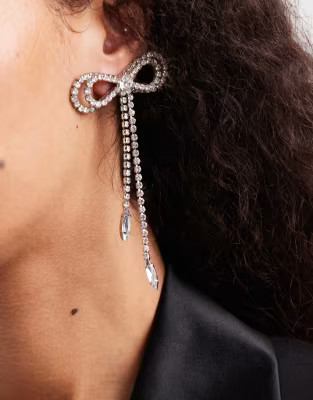 ASOS DESIGN stud earrings with diamante bow design in silver tone | ASOS | ASOS (Global)