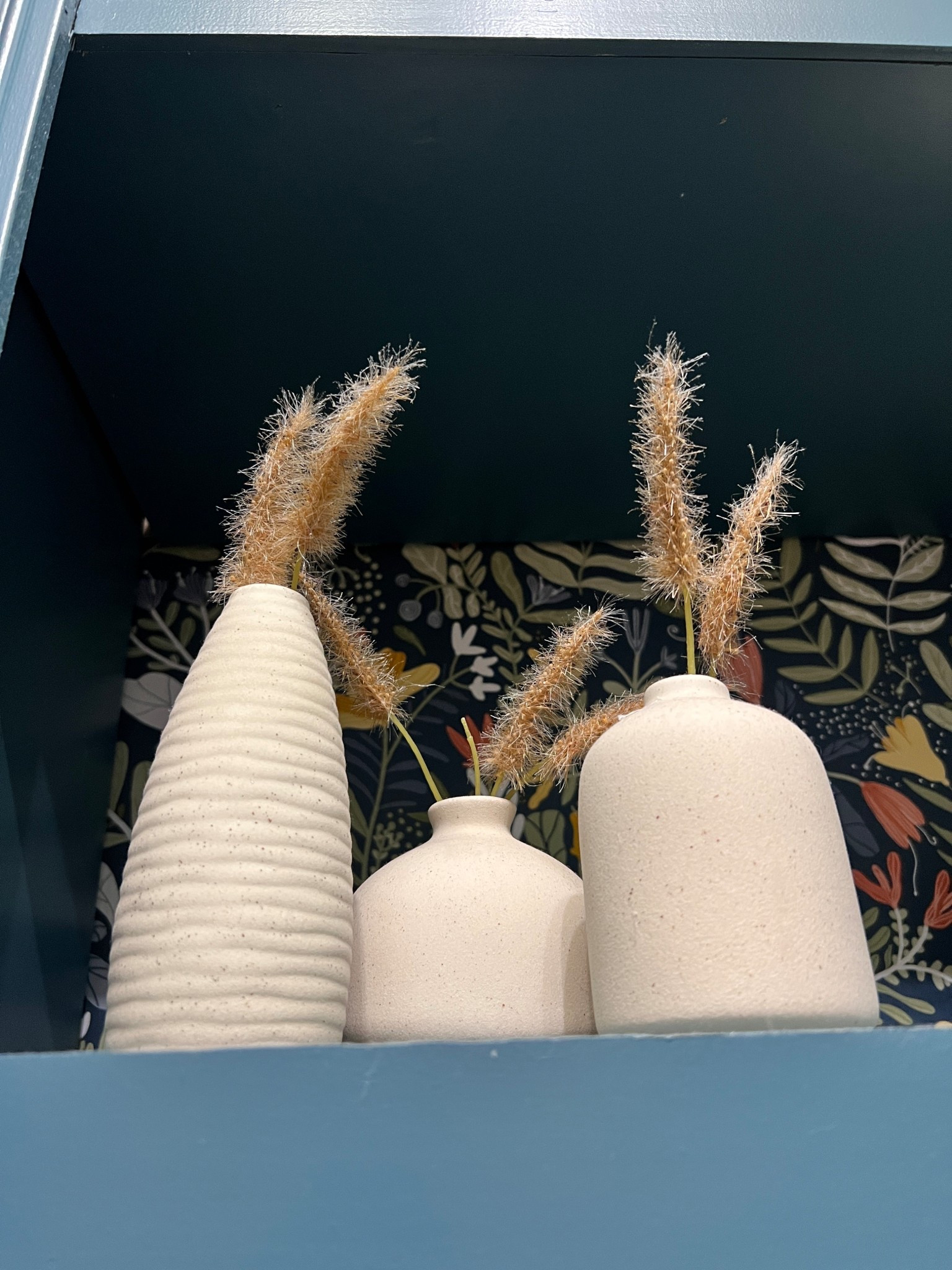 I added a few ceramic vases with faux stems to the laundry room and it instantly felt less like a chore zone and more like a finished space. The texture of the ceramics + soft greenery adds warmth without needing sunlight or upkeep.

#LTKHome #LTKSeasonal #LTKmomlife