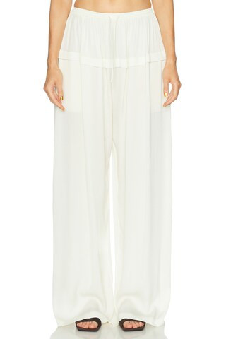 ALAÏA Peplum Pant in Cream | FWRD 