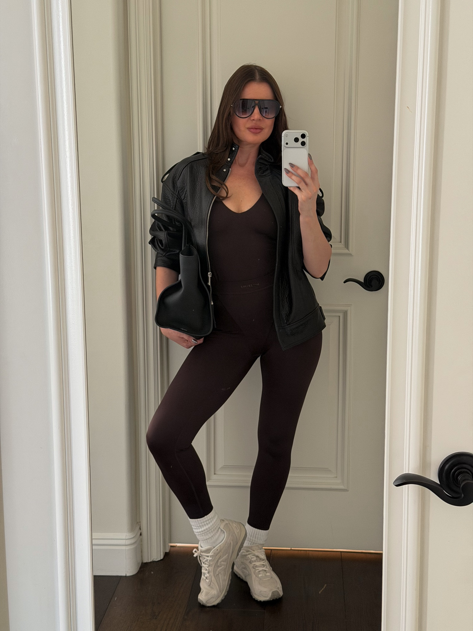 Styling skims x Nike collab set with a black leather jacket and suede new balance sneakers 
#suedesneakers #skims #workoutset #nike #chocolatebrown #brown #jacket #leather #bomber #sneakers #tote #therow 

#LTKootd #LTKActive #LTKfitnessgoals