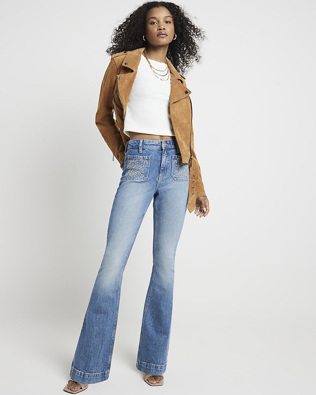 Blue high waisted embroidered flared jeans | River Island (UK & IE)
