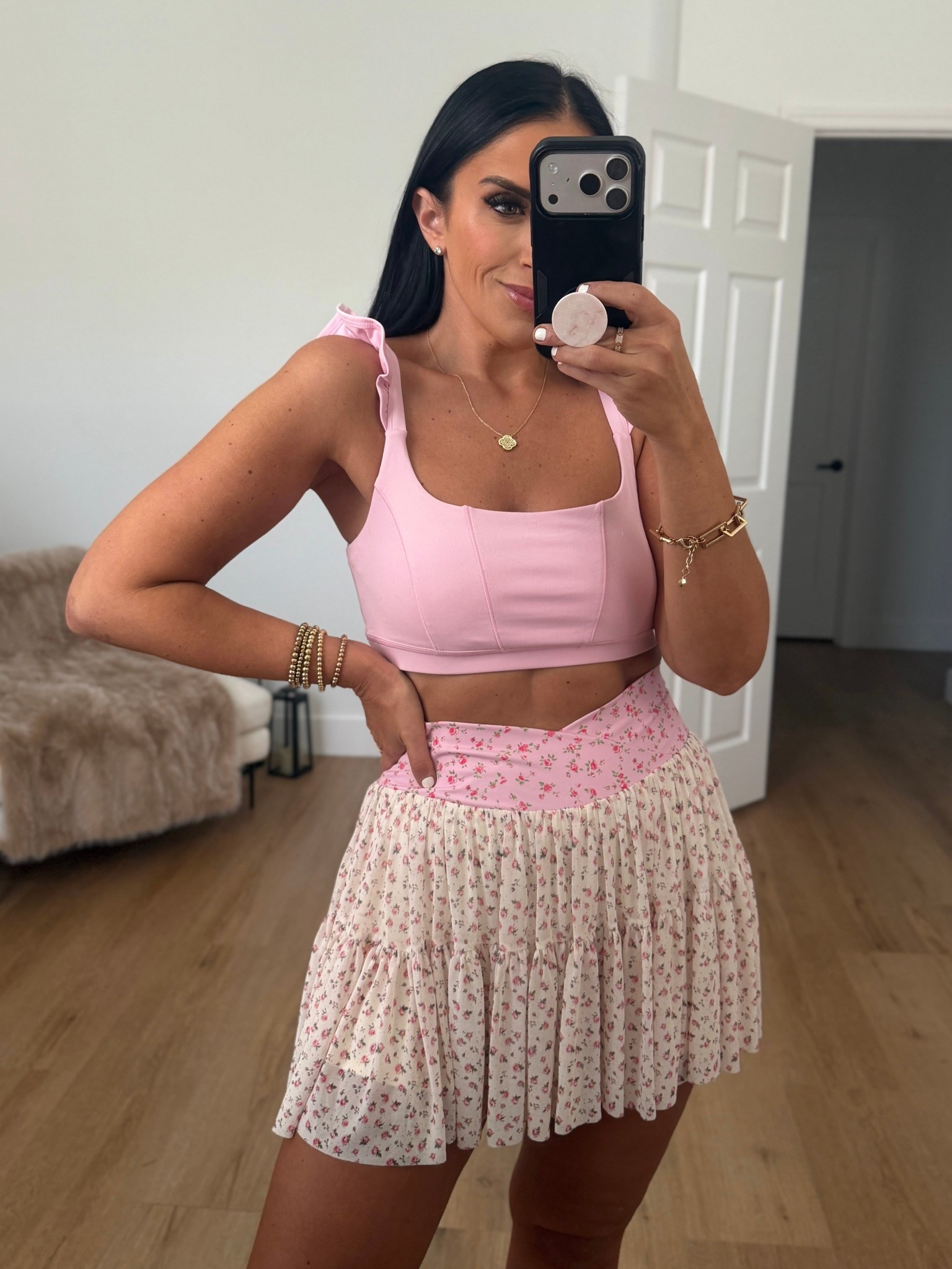 Blogilates Women's Ruffle Corset Sports Bra - Pink wearing size medium. Blogilates Women's Ballerina Skort - Pink Floral wearing size medium. 
