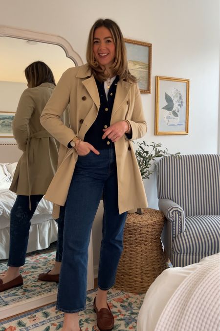 Classic, elevated, timeless, and preppy everyday look for spring. Trench coat, gold button navy blue cardigan, jeans and penny loafers. My jeans are currently 25% off!! 

#LTKstyletip #LTKsalealert