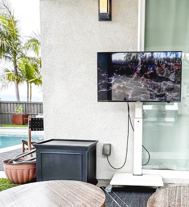 Take your TV outside with a standing monitor with wheels. We adapted a basic stand with casters from the hardware store since ours is outside and needs to roll over turf sometimes. I recommend using a smaller monitor to help with the total weight, ours is a 40 inch TV. And I do recommend one with less glare than our screen. We keep it on a covered patio and will bring it inside when the weather is bad. We use Apple TV with ours and when needed we will pair with our Sonos move for extra volume (usually when we want to watch games with friends). 
#outdoortv
#outdoorliving
#giftguides
#techgifts


#LTKHoliday #LTKHome #LTKGiftGuide