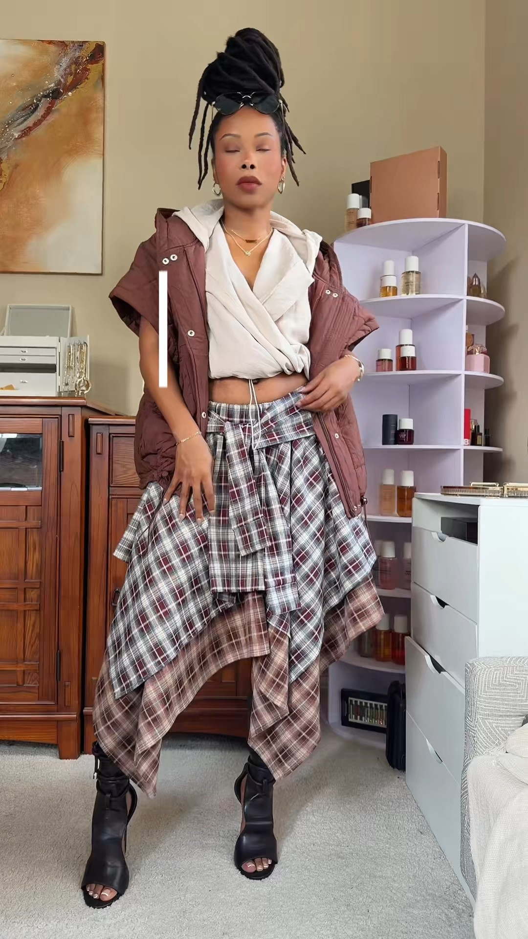 My OOTD of the day 🤎✨ Mixing textures and layers with the AKIRA Feeling All Over The Place Plaid Midi Skirt, a MUSERA Textured Linen Cowl Plunge Hooded Top, and an oversized quilted hooded puffer vest.

The perfect mix of trendy, cozy, and effortlessly chic. 🍂 Perfect for fall outfits, casual days, brunch, date nights, and weekend style.

📏 Plaid Skirt: Size Small

🛍️ Shop the exact pieces on my LTK!

#OOTD #OOTDOfTheDay #AKIRA #AKIRAFashion #PlaidMidiSkirt #PlaidSkirt #CowlNeckTop #HoodedTop #PufferVest #QuiltedVest #LayeredOutfit #FallFashion #FallOutfits #FallStyle #CasualChic #StreetStyle #BrunchOutfit #DateNightOutfit #WomensFashion #FashionFinds #LTKFashion #ShopMyStyle