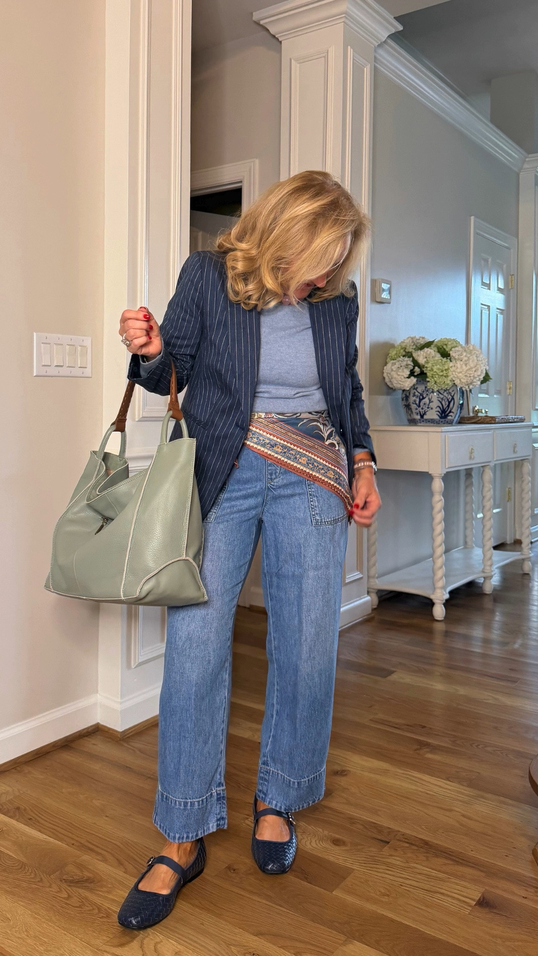 This navy pinstripe jacket makes relaxed denim feel instantly more polished. A soft blue top, wide-leg jeans, and woven Mary Jane flats keep the look comfortable, while the patterned belt adds just enough personality.

💡 LTK MADE EASY
❤️ Heart = Support my posts!
🔖 Save = Get sale & restock alerts
📋 Lists = Keep favorites organized
📲 Share = Send lists and products to a friend. Hello, Christmas List!
💬 Comment = Ask me anything about what I'm wearing.:-)

#LTKootd #LTKWorkwear #LTKOver40