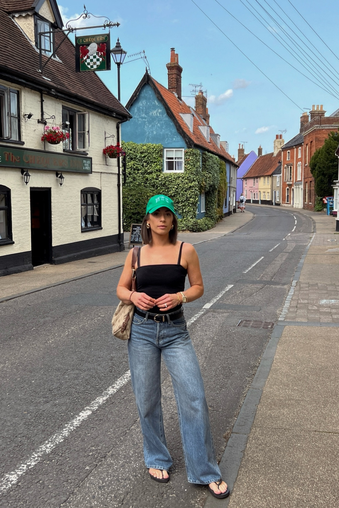 Everyday casual outfit. Baggy wide leg denim. Minimal flip flop. Vintage monogrammed boho shoulder bag. Chunky gold earrings. Weekend outfit. Weekend style. Casual style. Relaxed fit. End of summer outfit. Summer to fall transitional outfit. 

#LTKItBag #LTKFindsUnder100 #LTKTravel