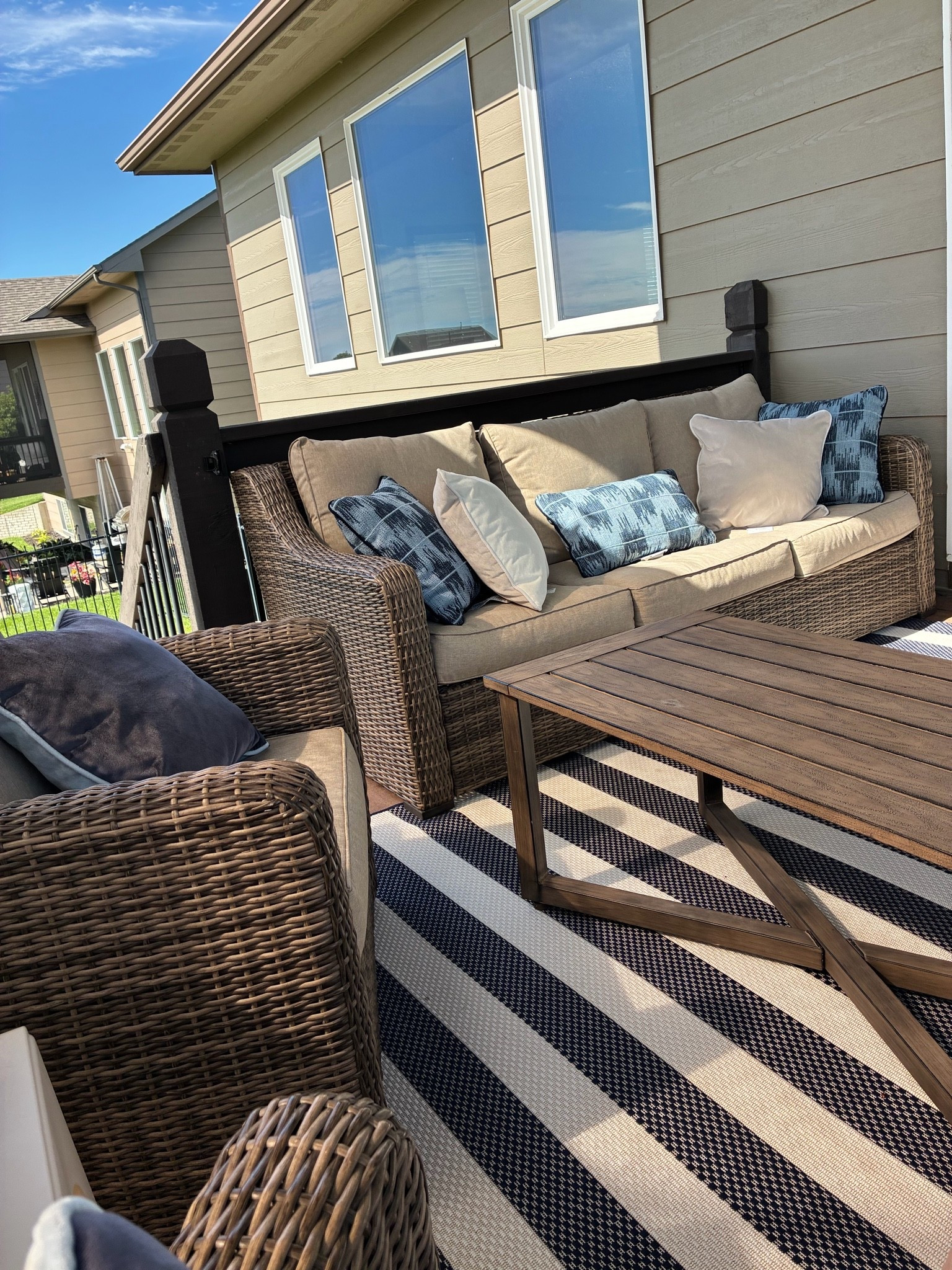 Furniture is Better Homes & Gardens Hawthorne Park Outdoor Wicker. This is our 4th year with it. 

Summer, patio, deck, outdoor furniture, blue, blue pillows, Americana, strip rug, 4th of july

#LTKmorningroutine #LTKHome #LTKSaleAlert