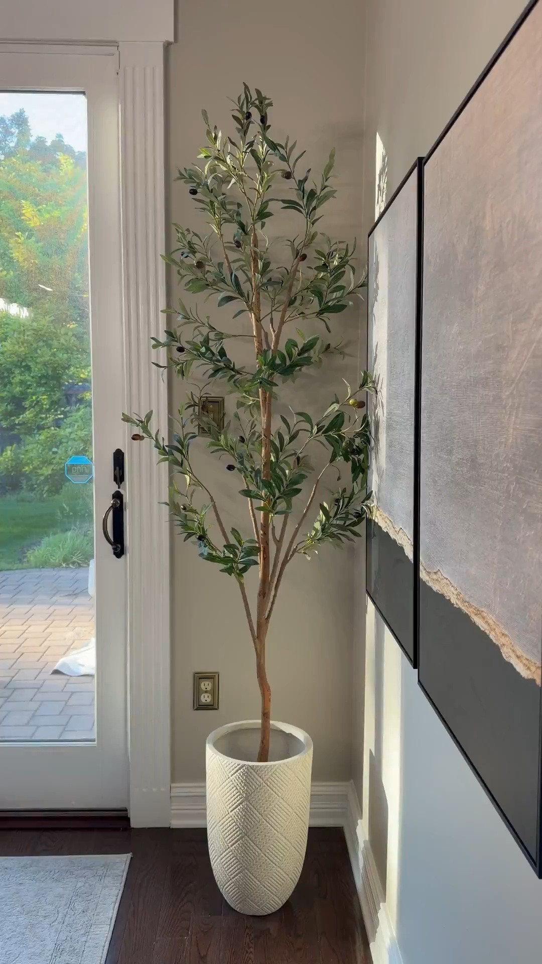#ad Styling hack: use faux trees in planters to add height, texture & warmth! I have 2 of these olive trees. They are great quality, look so real and very affordable!  #WayfairPartner @Wayfair @shop.ltk #ltkit #liketkit #Wayfair

#LTKSaleAlert #LTKHome #LTKSeasonal