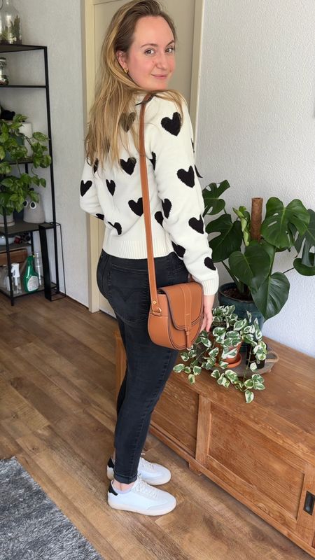 Casual everyday outfit in Levi’s black skinny jeans heart love shaped cardigan brown handbag and sneakers 

#LTKbag #LTKshoes #LTKstyletip