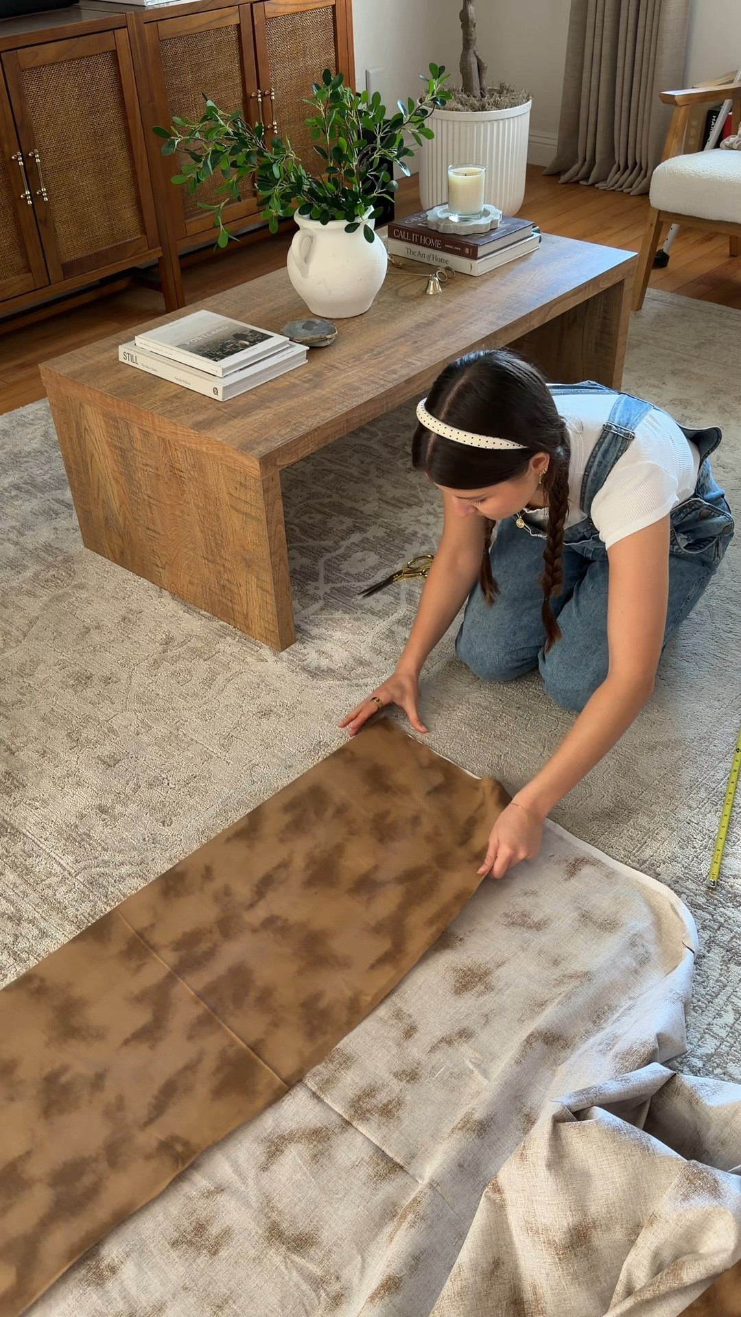 Quick living room DIY to cover up the clutter in our TV console 🔨 I got the fabric at Hobby Lobby! 

#LTKHome