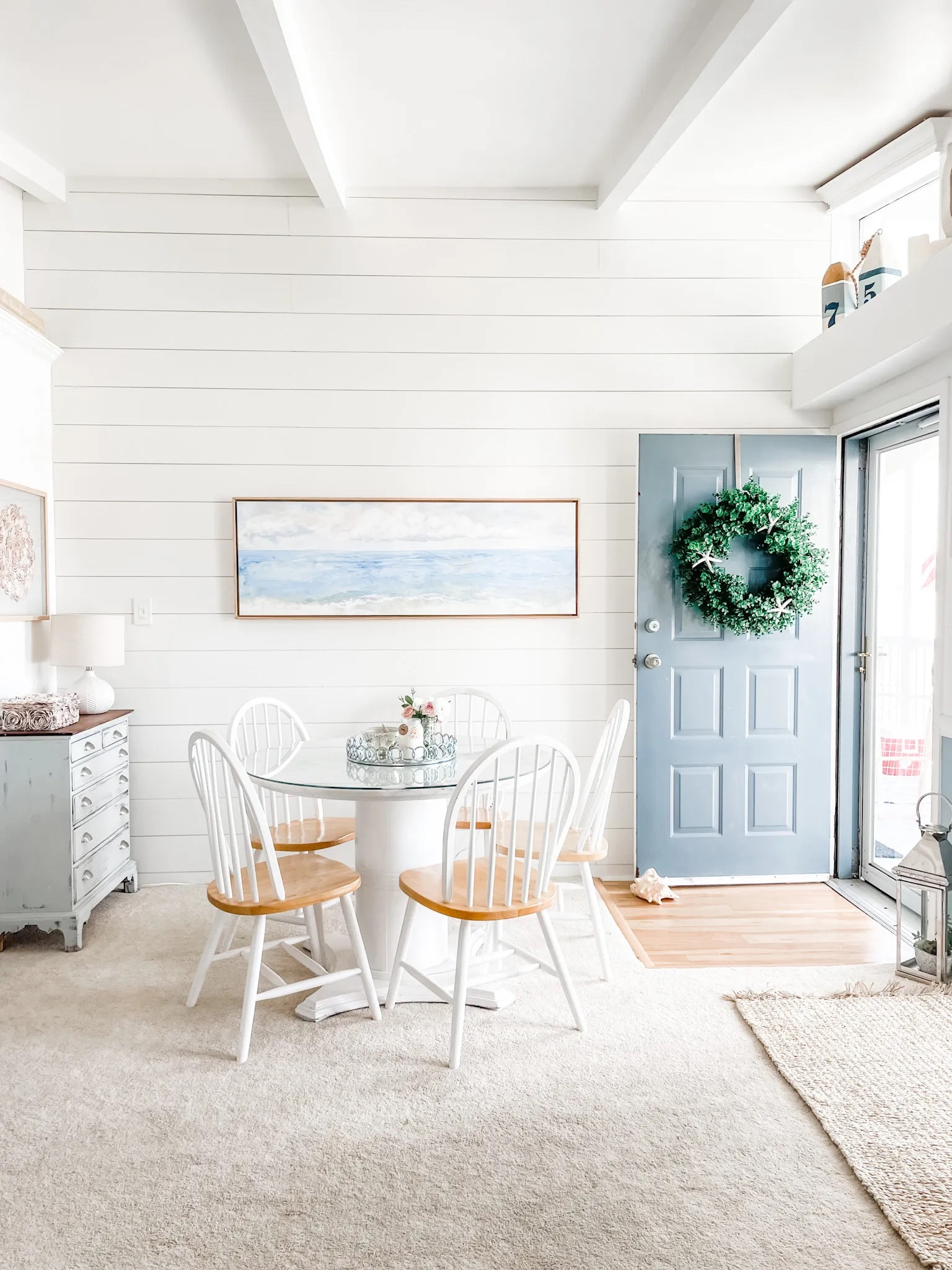 This abstract coastal canvas wall art is just what this shiplap wall needed in our beach condo!

Ceramic lamp, table lamp, canvas art, water landscape art, wall art, coastal decor. Coastal wall art, beach home, beach decor, Target lamp. Lindsay Letters abstract wall art, Crystal Tide watercolor canvas art. Round pedestal dining table, spindle back dining chair set, natural wood dining chair. White dining chair, jute area rug, neutral rug, natural rug.
#target #wallart #diningtable 

#LTKstyletip #LTKhome #LTKFind