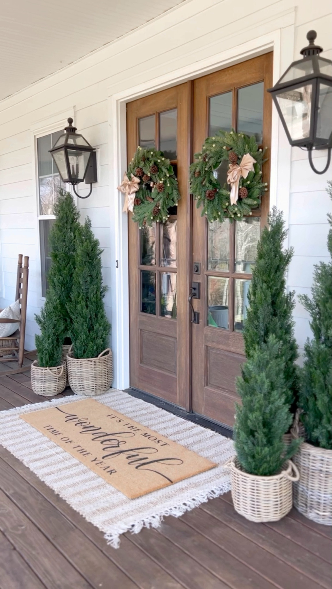 Christmas starts now! This was my most loved Christmas porch from three years ago! I love these cedar trees so much - the quality is amazing! Three years later I’m still using them outside all year round and they have held up so well! This porch was so simple and I loved the green and gold together! I’ve also used these wreaths for many years! 

#LTKHoliday #LTKHome #LTKStyleTip