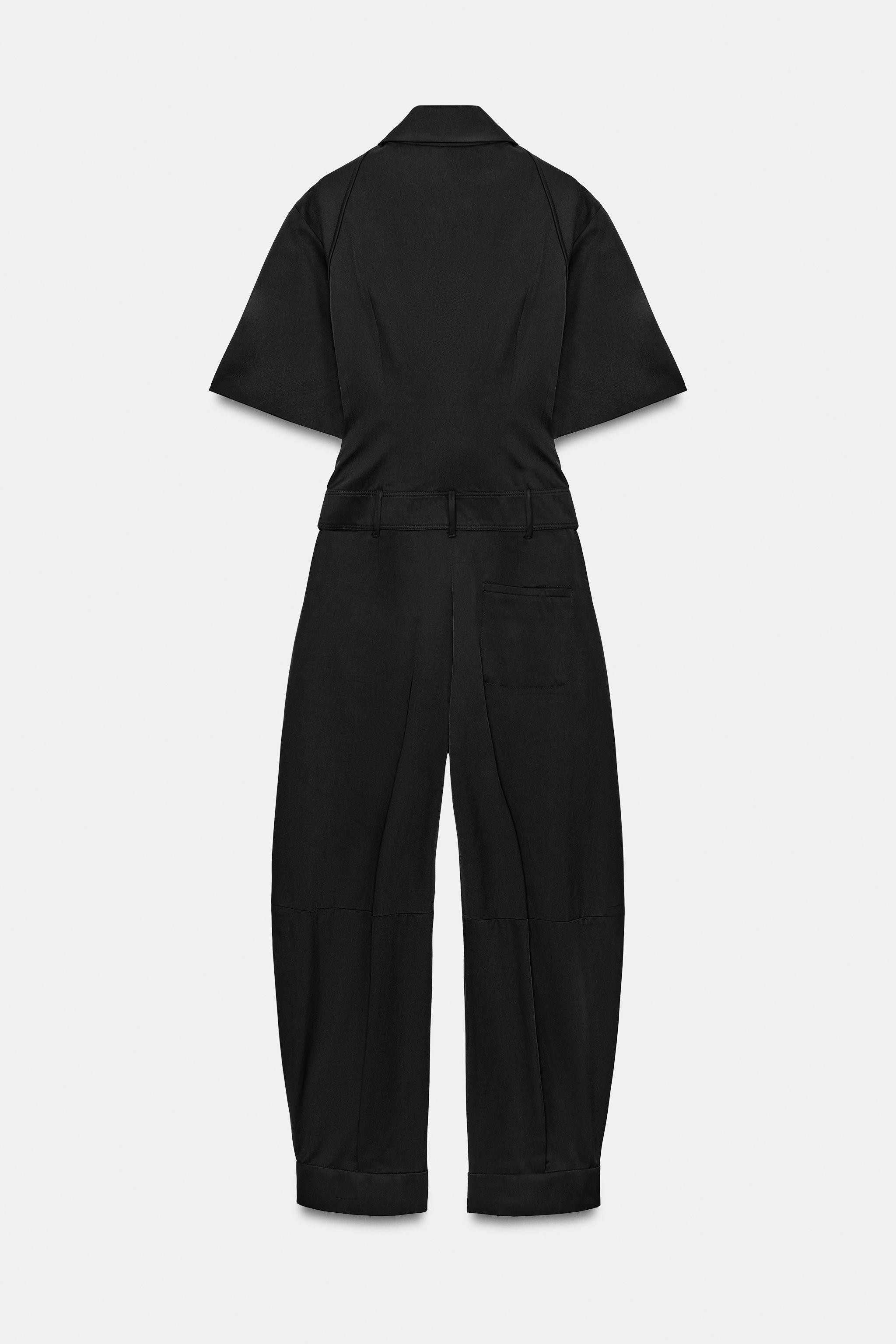 Long jumpsuit with a regular collar and short sleeves. Waist with belt loops. Side pockets and mo... | Zara UK