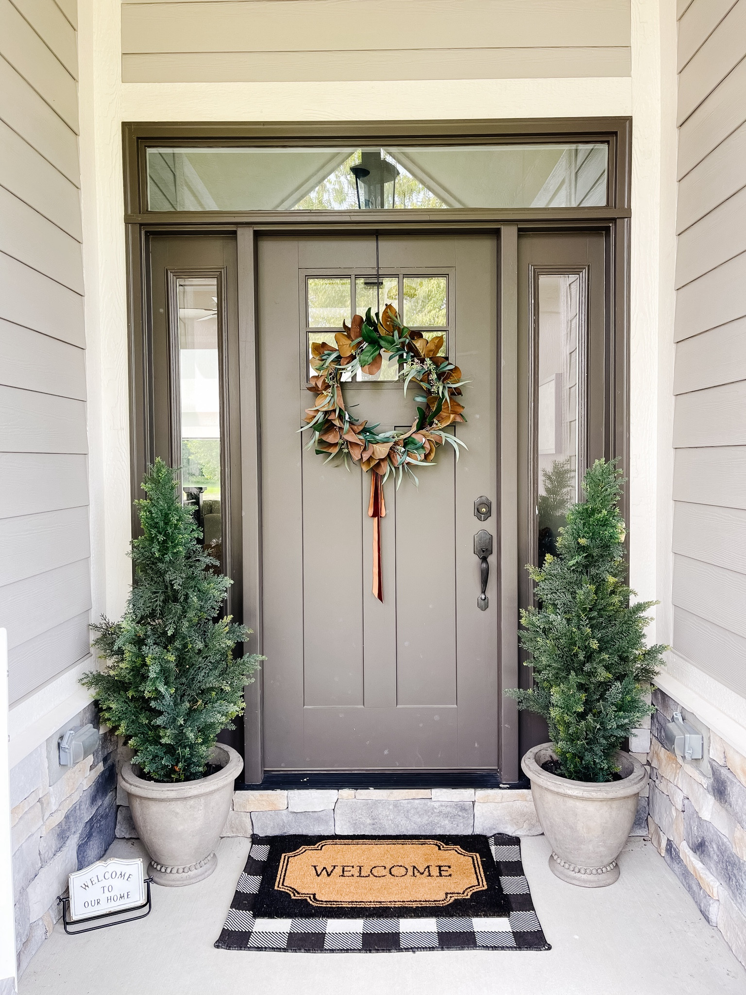 A little late summer / early fall porch! Grabbed a new magnolia wreath from Target and it is so beautiful for the price (I am very picky on my faux florals). Loved the copper ribbon bow! 🍂 

#LTKSeasonal #LTKHome #LTKFindsUnder50