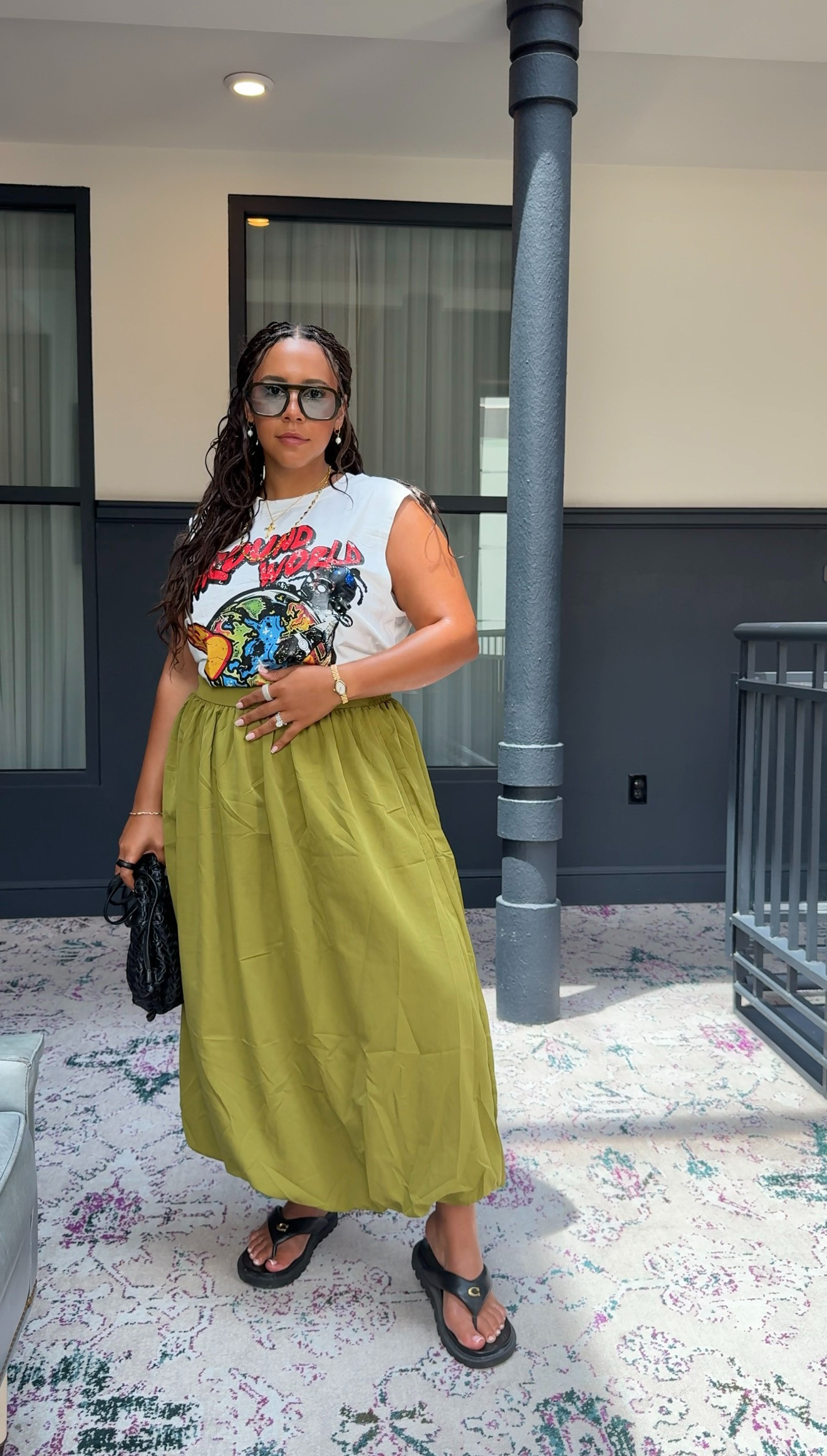 Essence outfit check. I love mixing casual and elevated pieces, and this look came together so effortlessly. The graphic sleeveless top, bubble maxi skirt, and accessories made it feel fun, chic, and so me. I've linked my whole outfit for you!

#LTKstyle
 

 #LTKootd #LTKMidsize