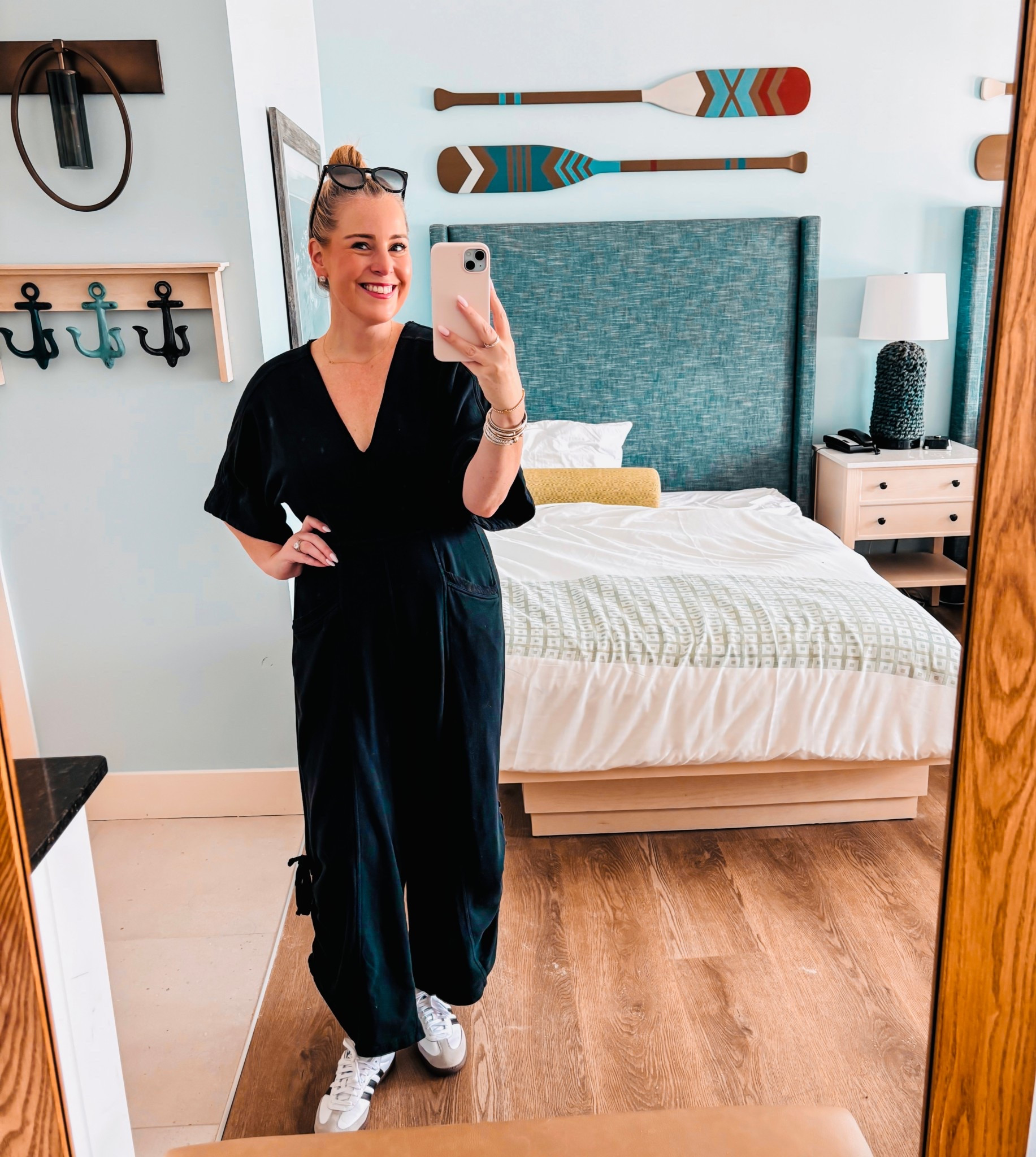 Love this black jumpsuit! Looks perfect with these adidas kicks … perfect transition item! Runs big … I am typically between a Medium and Large and I am wearing a medium! ✨ 🖤 

#LTKMidsize #LTKTravel #LTKOver40