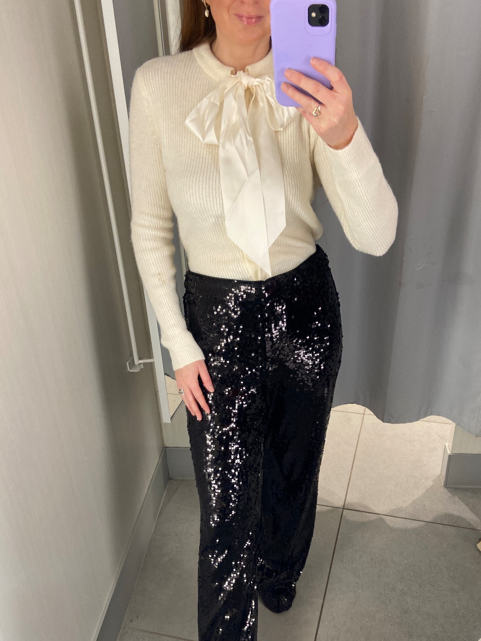 New in H&M Party 💃🏻🍸 Such a perfect Christmas cocktails look this cream bow-detail knit paired with the black sequin wide-leg trousers is so chic and festive. Team it with heels and you’ve got the ideal holiday party outfit. I’m wearing an XS in the top and a UK 10 in the trousers. Christmas outfits, sequin trousers, party outfits, sequins, Christmas party outfits

#LTKfestive #LTKpartywear #LTKuk