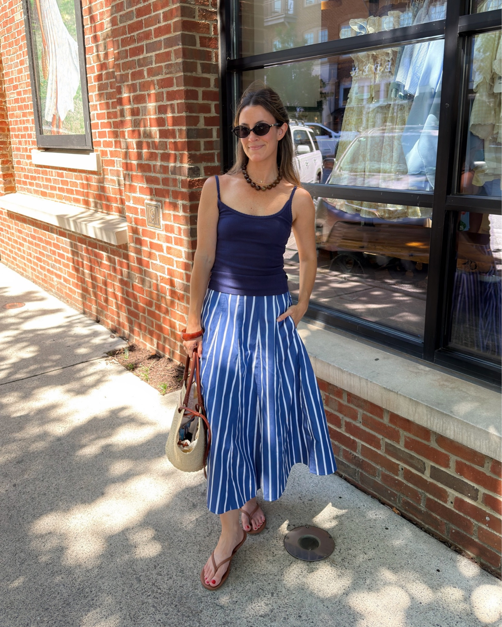 XXS in the skirt (sized down one and it’s perfect)
XS in the top 

easy but memorable outfit formula: 
simple tank + crisp cotton poplin skirt (she’s a statement!) + simple sandals *beaded necklace for a little pazaaz!! 🫐🫶🏼

comment “outfit” & I’ll send the links directly to you!