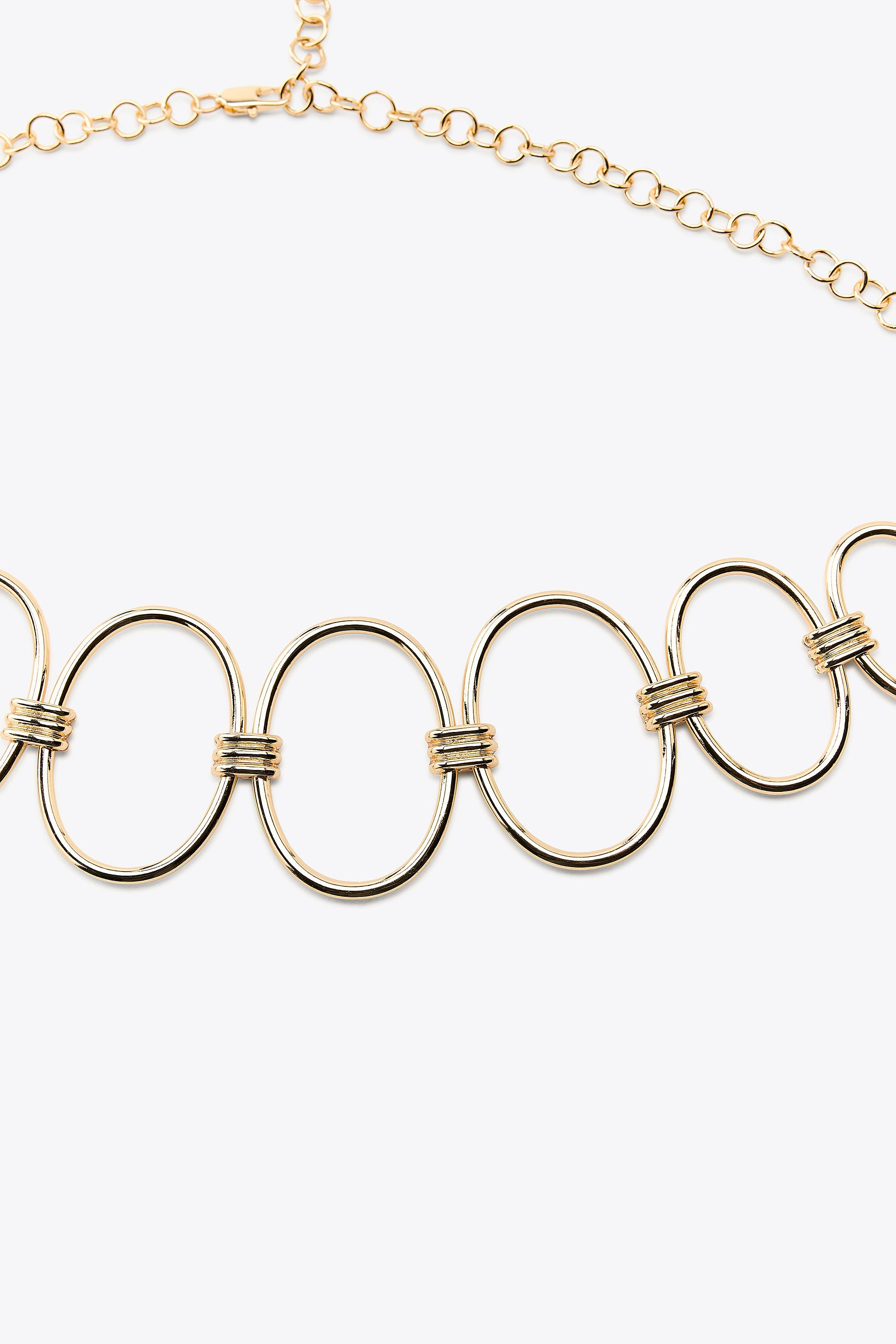 Metal chain belt made of circular pieces in different sizes. Lobster clasp fastening. | Zara UK