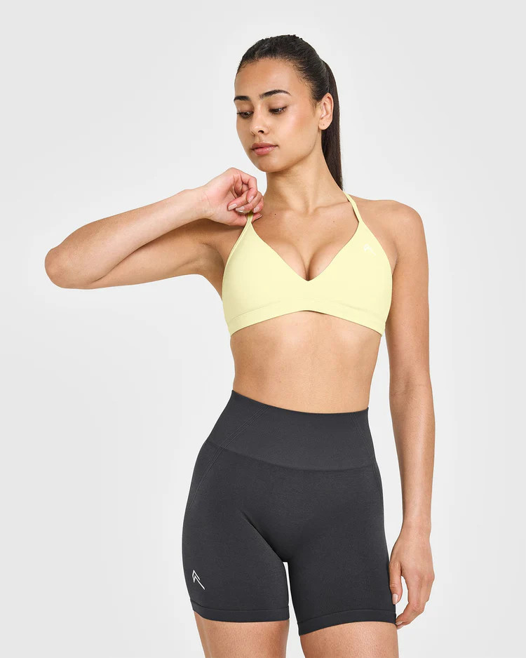 EasyLift™ Ultra Minimal V Neck Bralette with White Logo 
 Pastel Yellow | Oner Active (UK / US)
