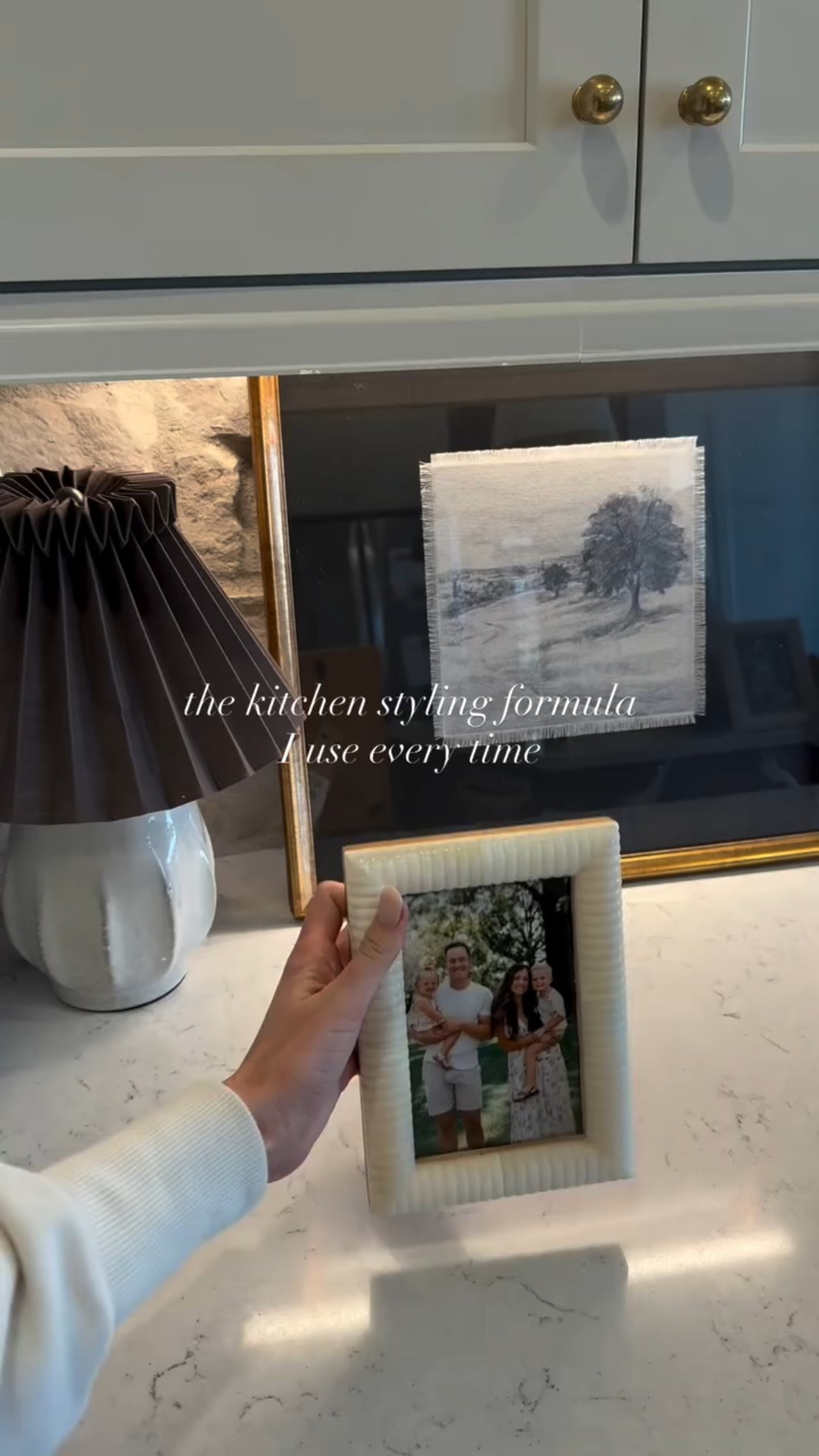 This is the kitchen styling formula I use every.single.time! It’s going to get you a beautiful look that adds style AND function 

Here it is- simple but effective 
1. One functional anchor (something you actually use) for me, it’s a beautiful vase with all my wooden spoons. 
2. A lamp! Truly one of my favorite touches in a kitchen. Lighting adds such a sweet warmth to any space. 💡 I love my little cutie with a pleated shade 
3. ART! Make it personal, make it pretty. Something that means something that brings character into your home 

Need some links? I got you! Just comment SHOP & I’ll send them right to ya 😉