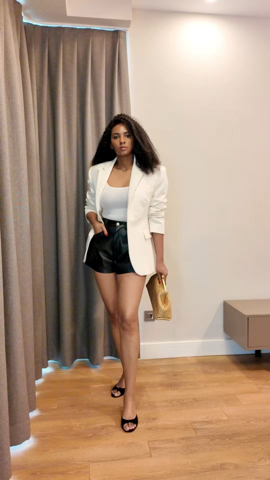 Pairing a white blazer with black leather shorts creates the ultimate contrast between polished and playful. Perfect for a night out or a bold daytime look. 

#LTKstyletip