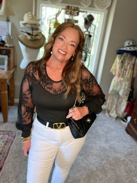 A beautiful black bodysuit with lace sleeves and yolk.  Perfect for date night.
I love it with white jeans and black accessories.

#LTKunder50 #LTKSeasonal #LTKstyletip