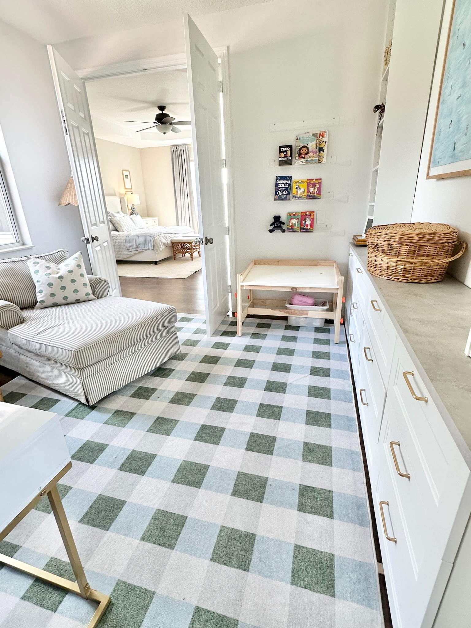 This blue and white checkerboard rug was such a fun touch in our Florida home. Loved it for our kids' playroom. Blue and white home, checkerboard area rug, grandmillennial style 

 #LTKHome #LTKKids #LTKFamily