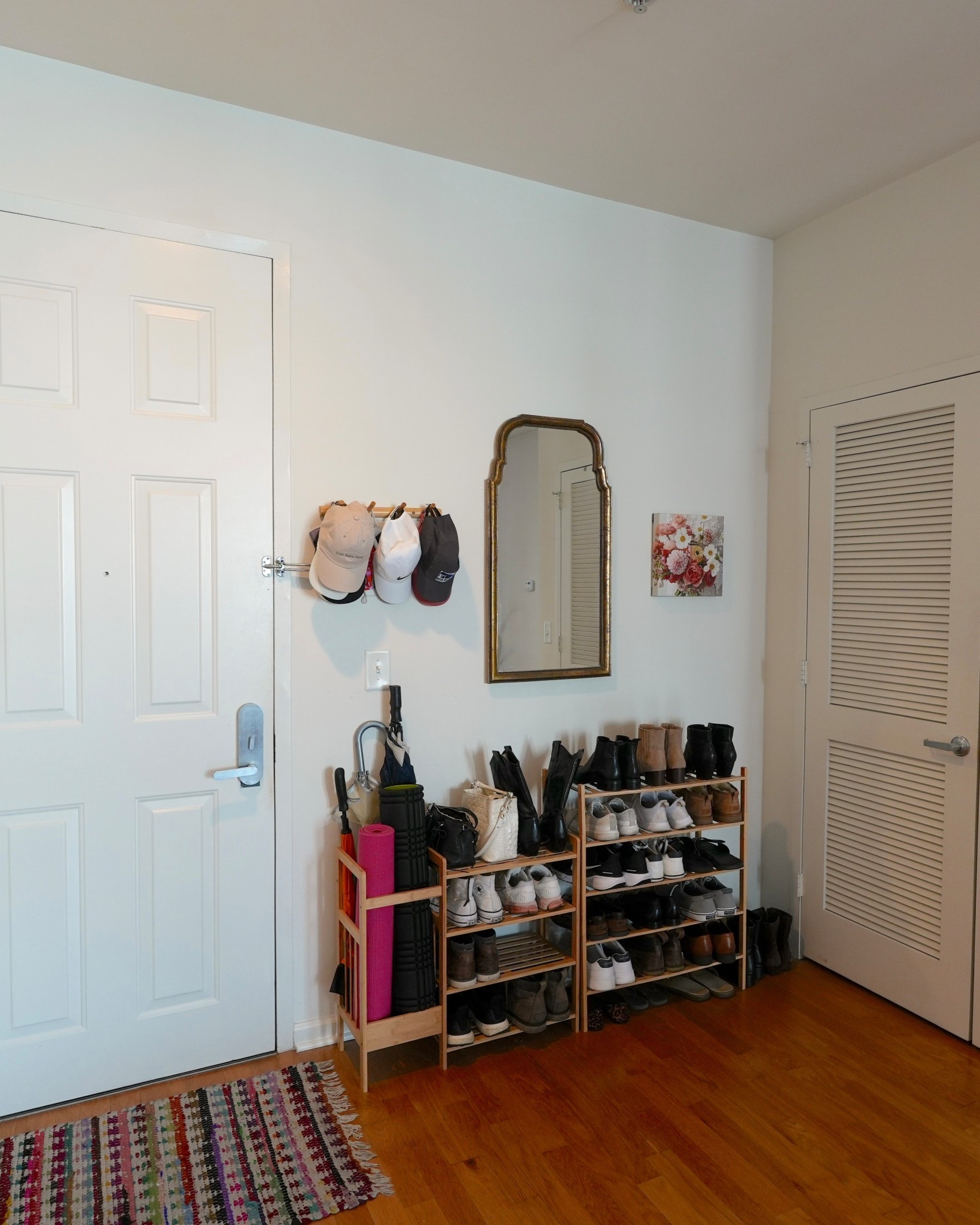 The entryway is small but super functional. I added a patterned rug to make it feel more inviting, and a black metal shoe rack keeps everything organized. Hooks on the wall are perfect for coats, bags, and hats, while a mirror helps with last-minute outfit checks before heading out. It’s simple, but it makes coming home feel so much cozier.

#LTKHome #LTKFindsUnder100