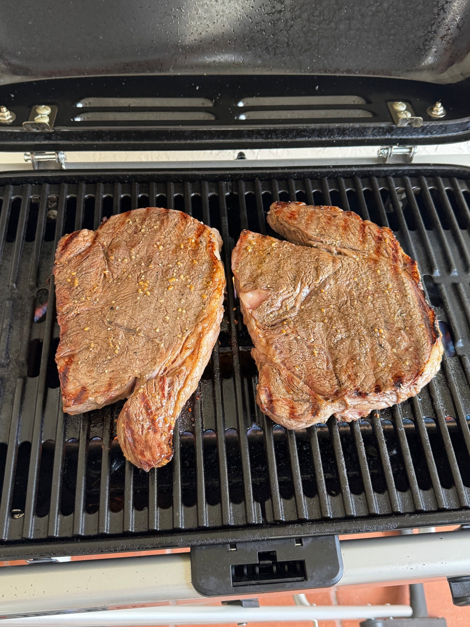 Grilling steaks on our portable Weber grill 

#LTKfoodie #LTKdayinmylife #LTKHome