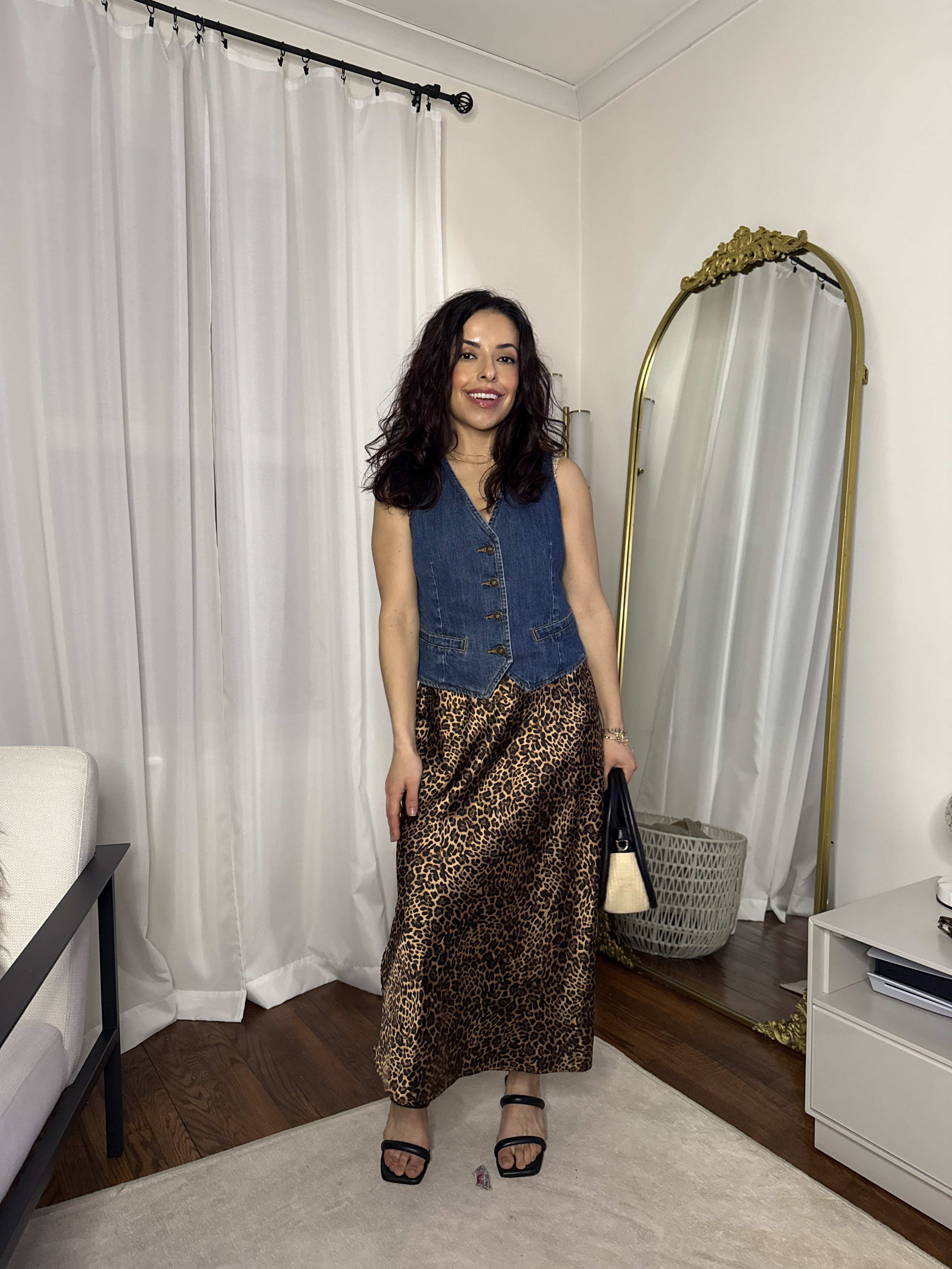 Early fall outfit idea: leopard print silky skirt, denim vest, Amazon sandals, and a woven bag. Petite. Animal prints for autumn.  

 #LTKFindsUnder100 #LTKStyleTip #LTKautumn