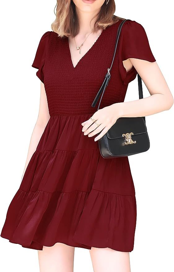 Women Smocked V-Neck Skirt Summer Flutter Cap Sleeve Tiered Mini Dress Fashion Babydoll Dress | Amazon (US)