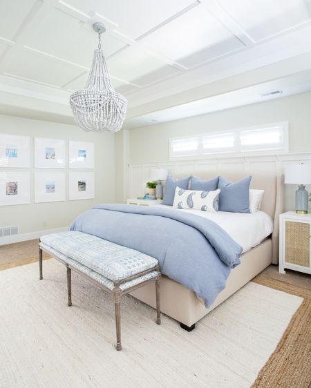 These light and bright bedroom decorating ideas in our previous master bedroom include a blue duvet, a white and blue paisley lumbar pillow, a faux fern and a blue glass table lamp. Other items include a white nightstand with rattan cane doors, a wood beaded chandelier, a white jute rug, a blue and white batik upholstered bench and white picture frames.  Items not shown include a light wood dresser, a faux olive tree and striped linen curtains. 

simple decor, home decor, master bedroom decor, targetfanatic, target style, amazon finds, walmart home, bedroom bedding, long size bed, bedroom rugs, guest bedroom decor, studio mcgee, target finds, target home, master bedroom inspiration, guest bedroom inspo, bedroom benches, coastal design, master bedroom, coastal bedroom, simple decorating, bedroom decorating 

#LTKSeasonal #LTKunder50 #LTKunder100 #LTKhome #LTKfamily #LTKstyletip #LTKsalealert #LTKstyletip #LTKSeasonal #LTKhome