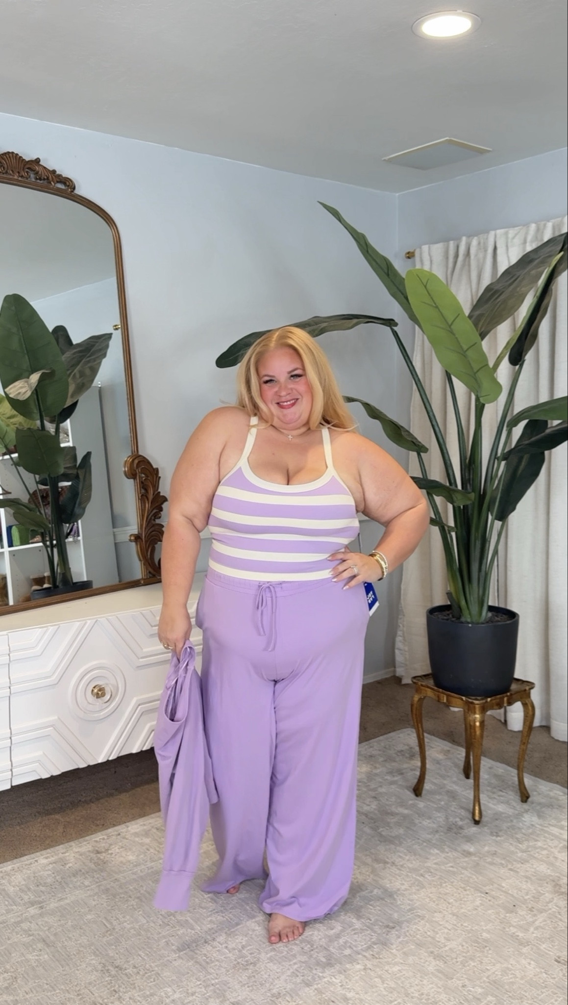 Lavender lounge but make it flattering 💜

This striped tank is supportive and stretchy without feeling tight, and the wide leg pants are that perfect drape that skims instead of clings. High rise, comfy waistband, and actually long enough to feel elevated.

It’s the kind of set you can wear at home, to run errands, or throw on sneakers and go. Comfortable does not have to mean shapeless.

Everything is linked in my LTK with sizing details.

#LTKOver40 #LTKPlusSize #LTKActive