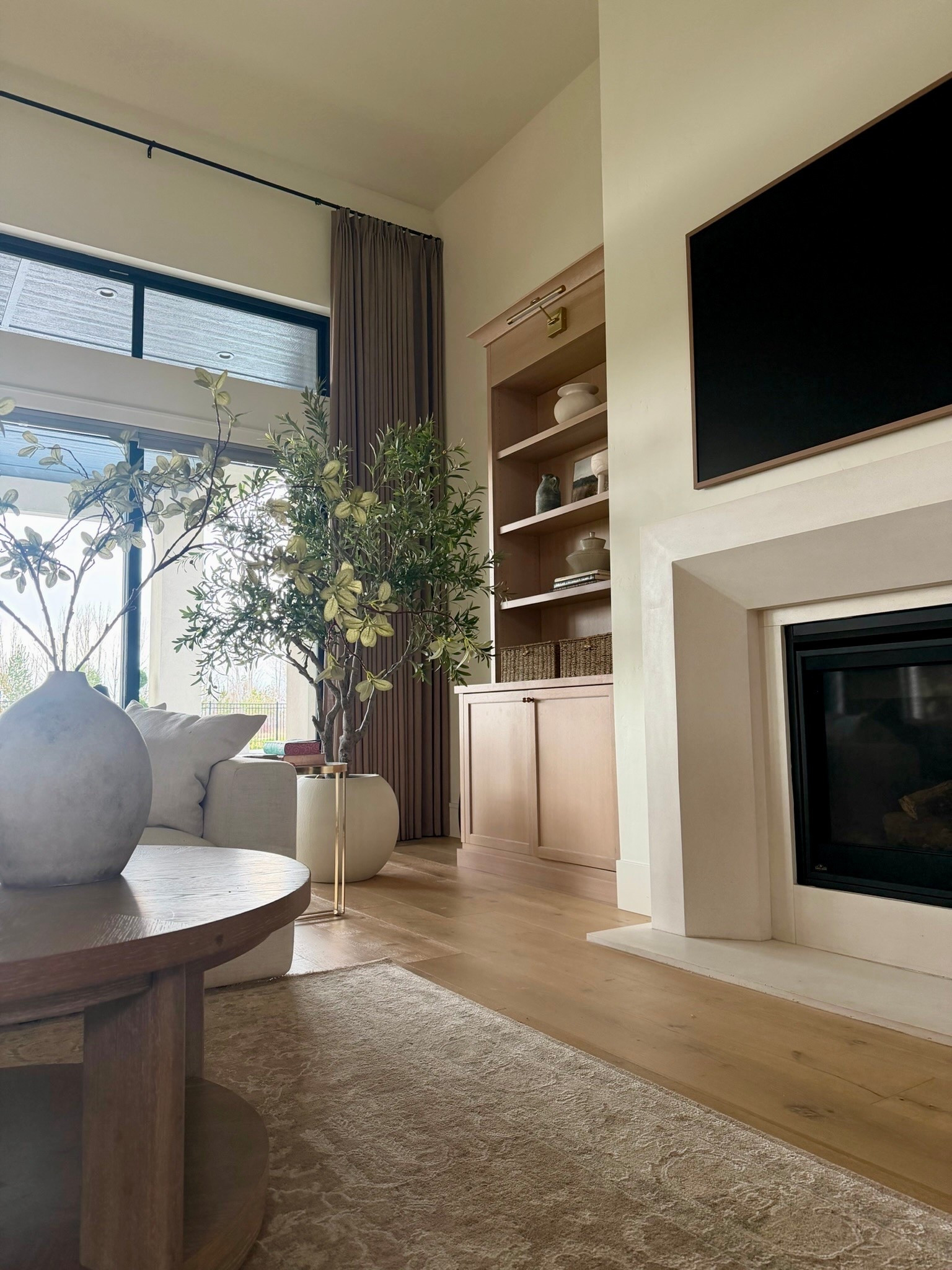 I’m always drawn to spaces that feel warm, layered, and calm, and this living room has so many of the pieces I continue reaching for lately. The soft vintage-style rug, oversized olive tree, warm wood tones, and textured decor all work together in such an effortless way.

I especially love mixing natural materials with clean lines to keep a room feeling elevated but still comfortable for everyday living. Everything linked here is part of that timeless neutral look I never get tired of.
@Wayfair 
@walmart

#LTKU #LTKHome #LTKSaleAlert