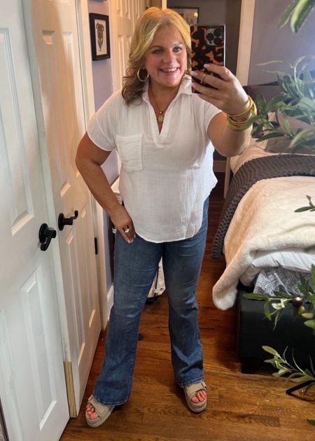 What is more classic than a comfy white top with jeans? Pretty much nothing, IMO!
This gauze, pull over top is sooooo soft and roomy. I have paired it here with Ugg wedge sandals and flare jeans. If it ever warms up, this top will look adorable with jean shorts or khaki shorts.
Casual outfits, summer outfits, jeans, pullover, tunic, Evereve, flare jeans 

#LTKMidsize #LTKSeasonal #LTKFindsUnder100