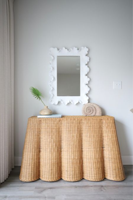 Scalloped rattan console table and scalloped mirror, classic coastal home decor 

#LTKFindsUnder50 #LTKHome #LTKStyleTip