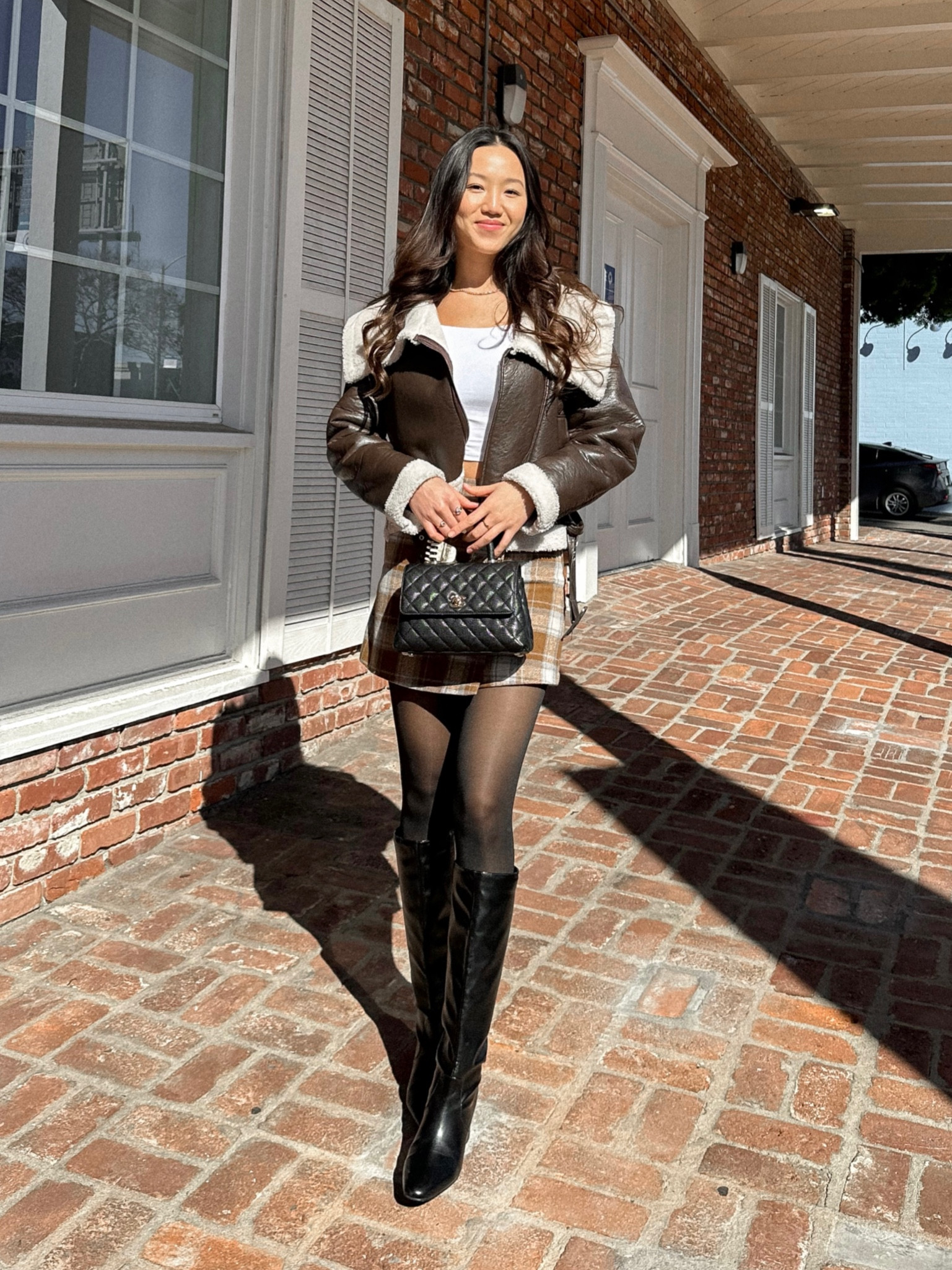 Spring transitional outfit 
• Brown faux leather jacket
• White long sleeve tee
• Brown plaid skirt
• Black faux leather boots

#LTKSpringSale #LTKSeasonal #LTKfindsunder50