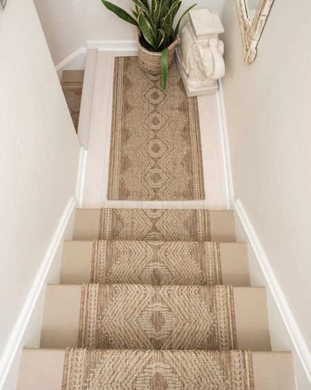 This indoor outdoor rug is the perfect runner for stairs. We’ve had this setup for several years with heavy traffic and cats and it’s still doing great! Love the tribal look and neutral brown colors | carpet | area rug | 

#LTKstyletip #LTKhome