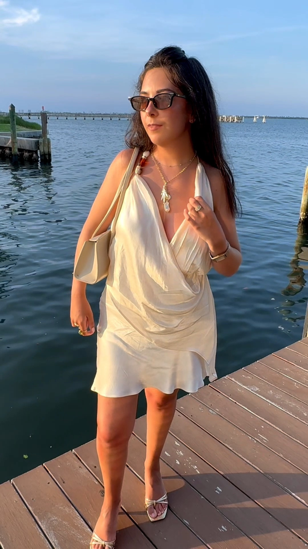 The little white dress that does all the work 🤍 An easy summer mini for vacation dinners, sunset drinks, date nights, or any excuse to dress up. Styled with neutral accessories and strappy heels for a simple, elevated summer look ✨

#LTKootd #LTKSeasonal #LTKTravel