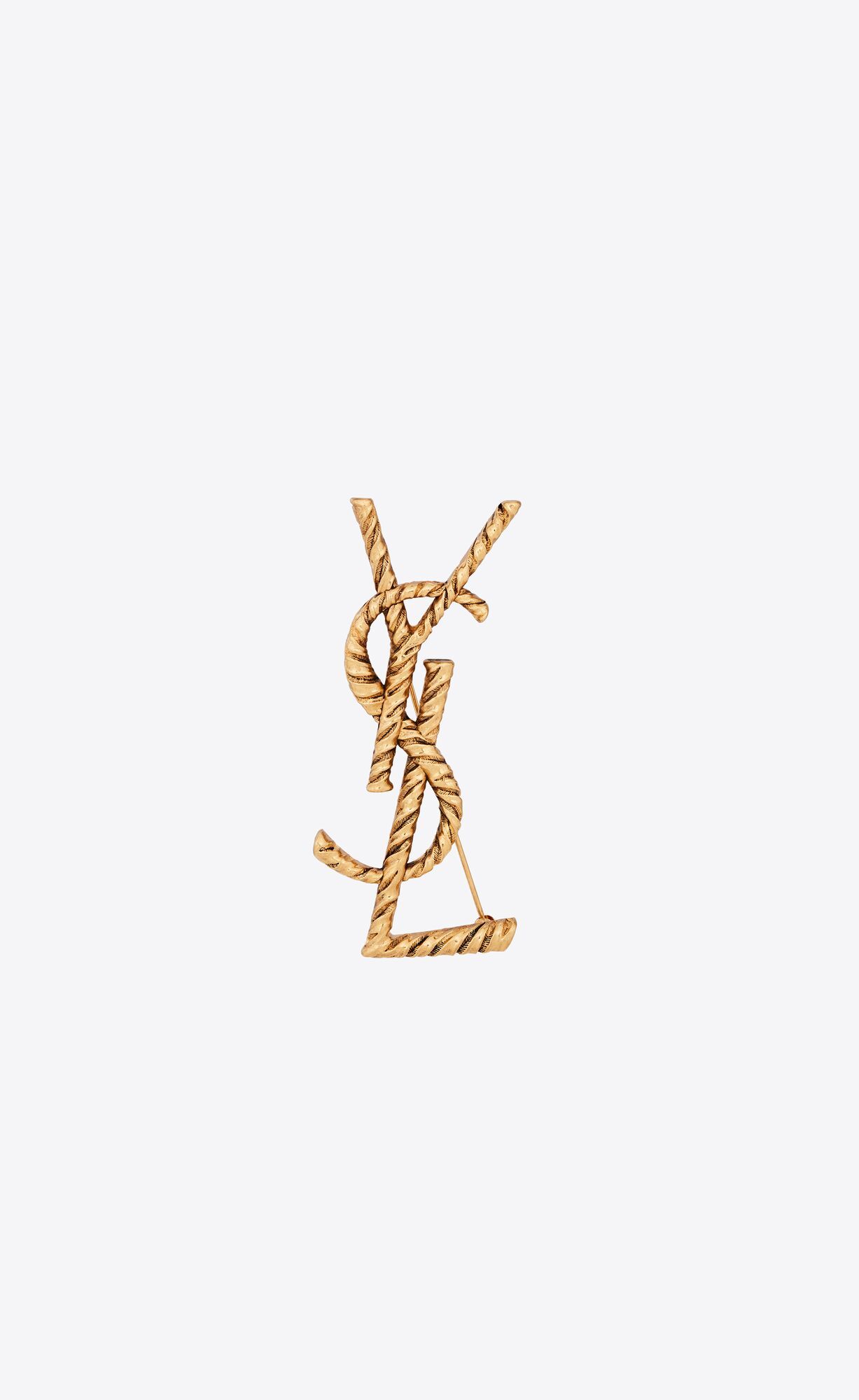 ysl monogram brooch with a twisted stripe texture. | Saint Laurent Inc. (Global)