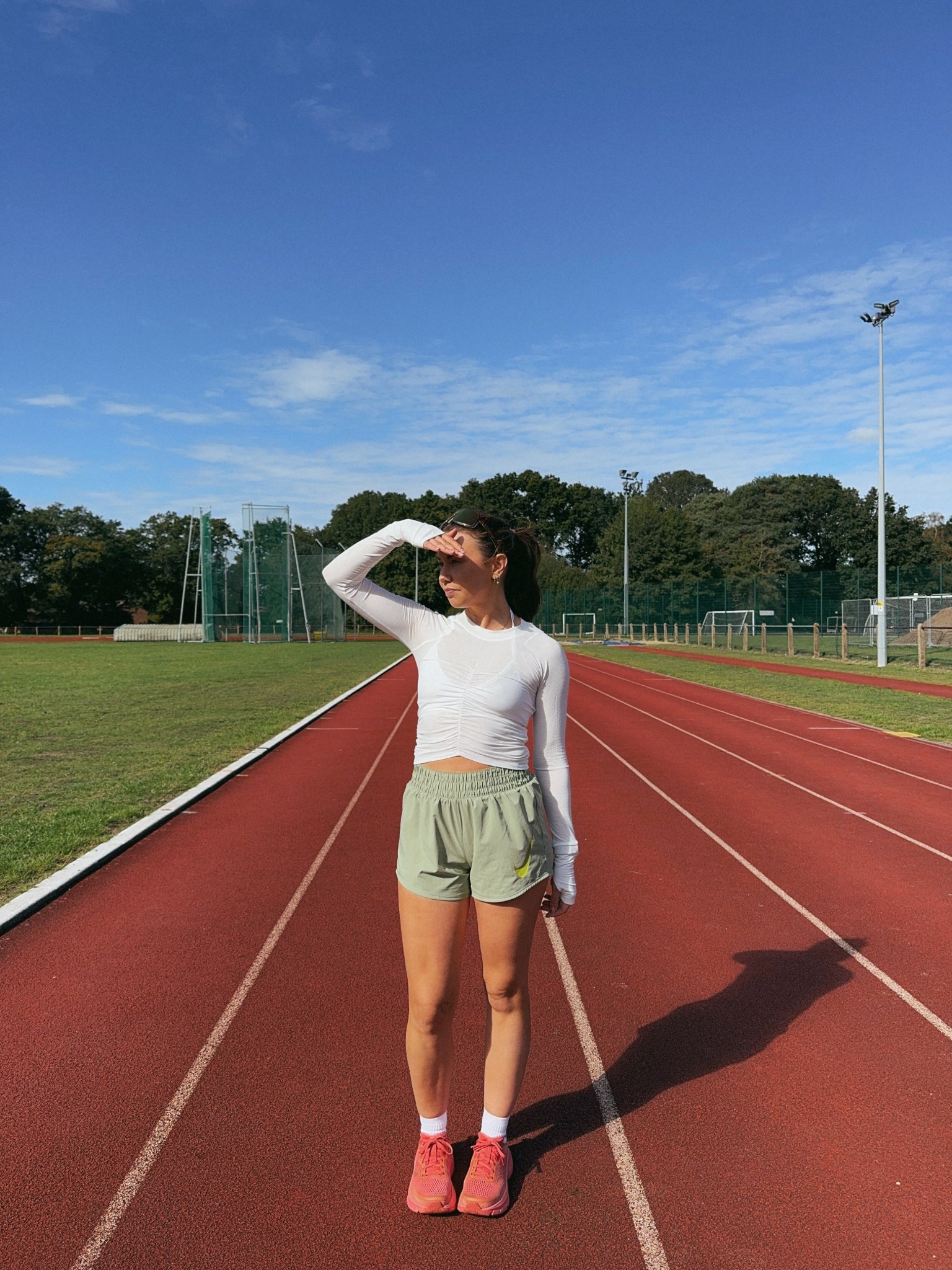 A cute running outfit wearing the viral free people workout long sleeve top with Gymshark Halterneck sports bra and Nike green run shorts with Saucony guide trainers in orange coral 

#LTKuk #LTKfitness #LTKautumn