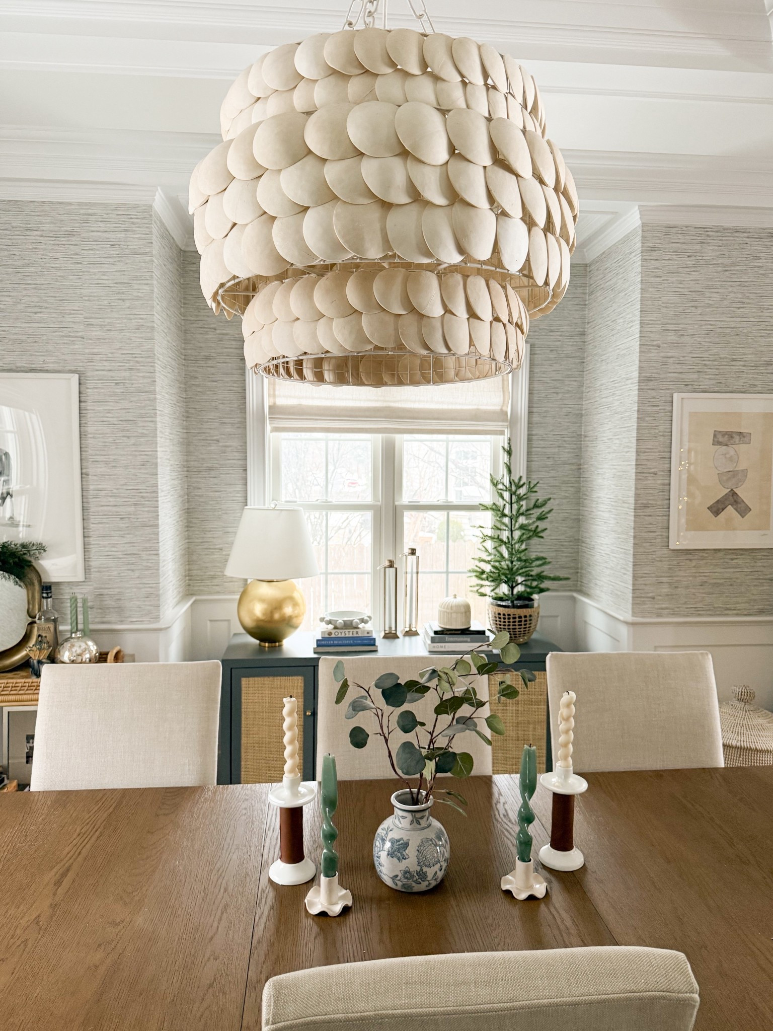 Soaking up the last of the long holiday weekend ✨ Well be taking our trees down soon but keeping up a few mini trees and all of the candles! 

Dining room inspo, winter dining room. Grasscloth wallpaper, Anthropologie, minted art, Serena & Lily chandelierr

#LTKSeasonal #LTKHome #LTKSaleAlert