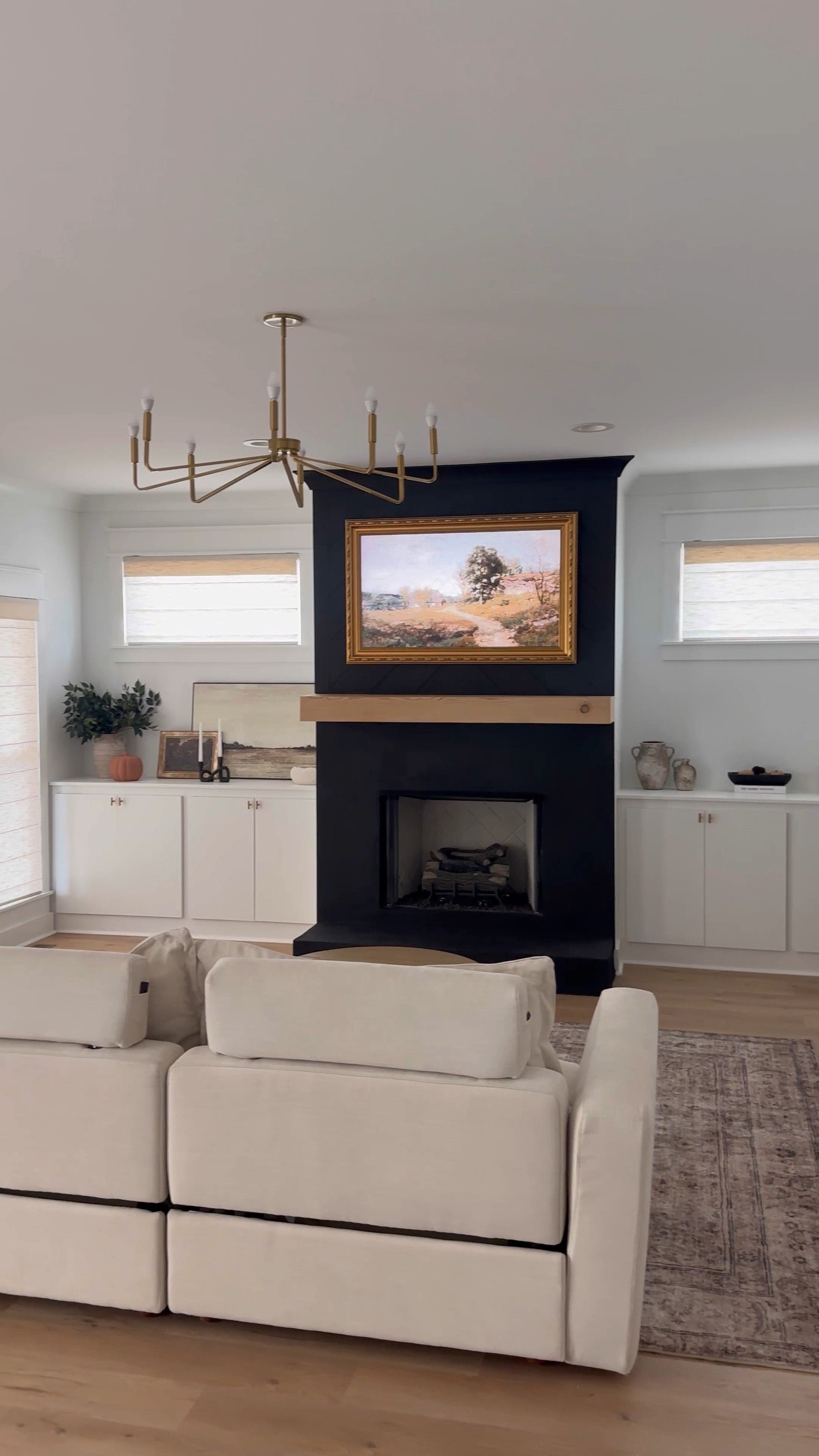 Fireplace glow up 🖤✨ 
Adding touches of black with neutrals is my current obsession 😆
#fireplace #fireplacemakeover #livingroom #livingroomdecor #homeDIY 

#LTKHome #LTKStyleTip #LTKVideo