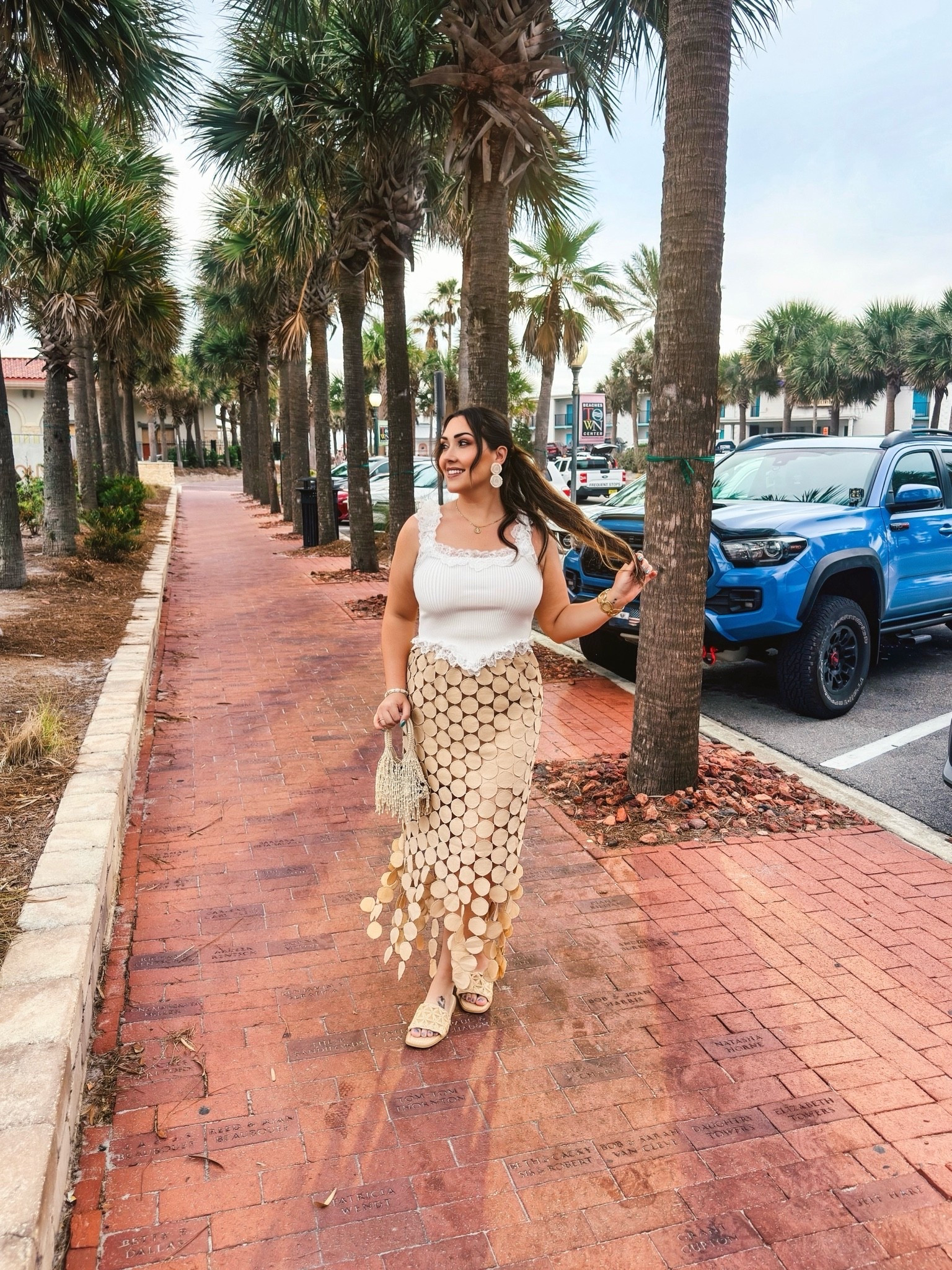 Vacation dinner outfits are my favorite excuse to dress up 🤍 Loved mixing textures with this lace tank and statement skirt moment.

#LTKootd #LTKTravel #LTKSeasonal